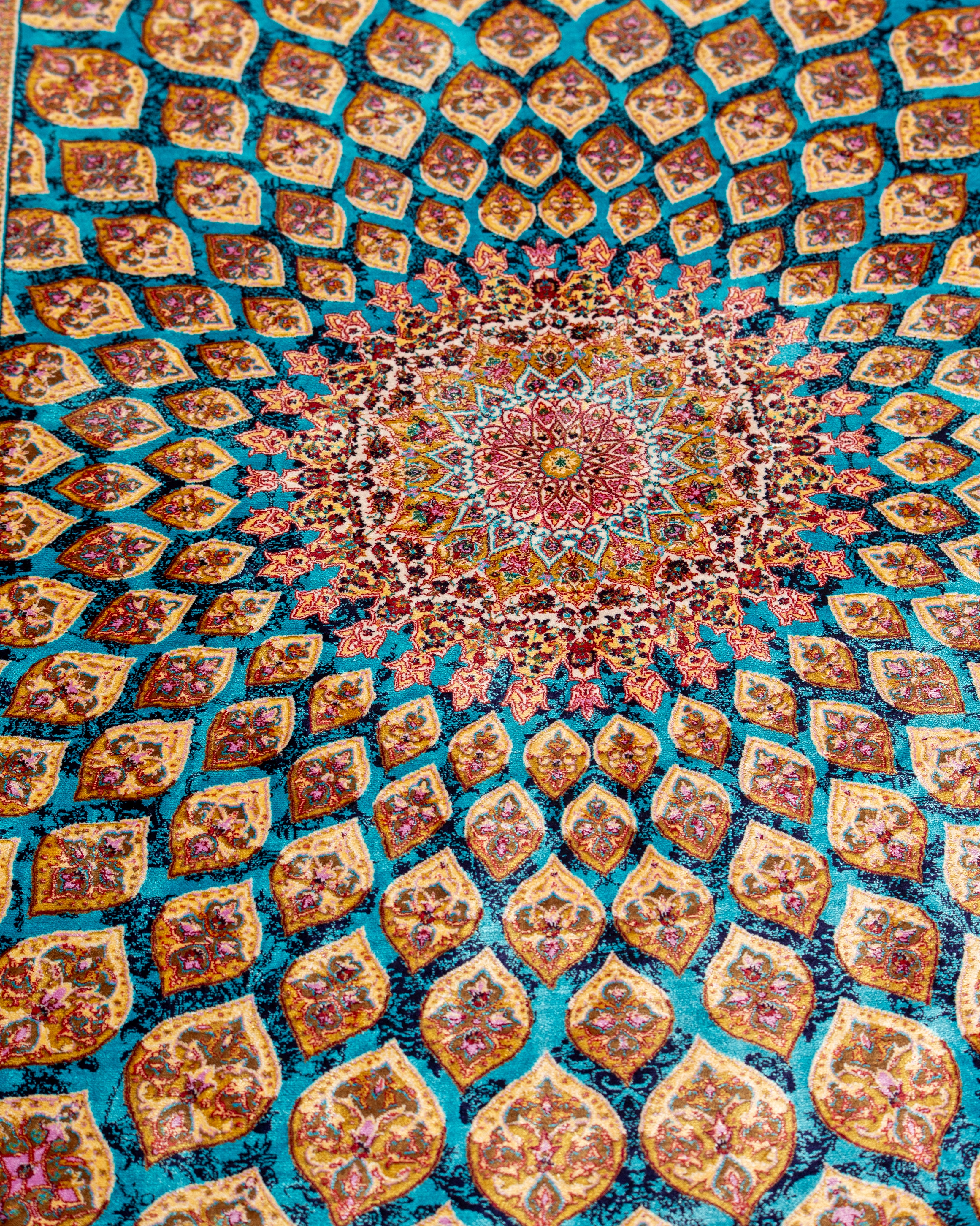 Central dome medallion detail of the Firuzeh turquoise silk rug