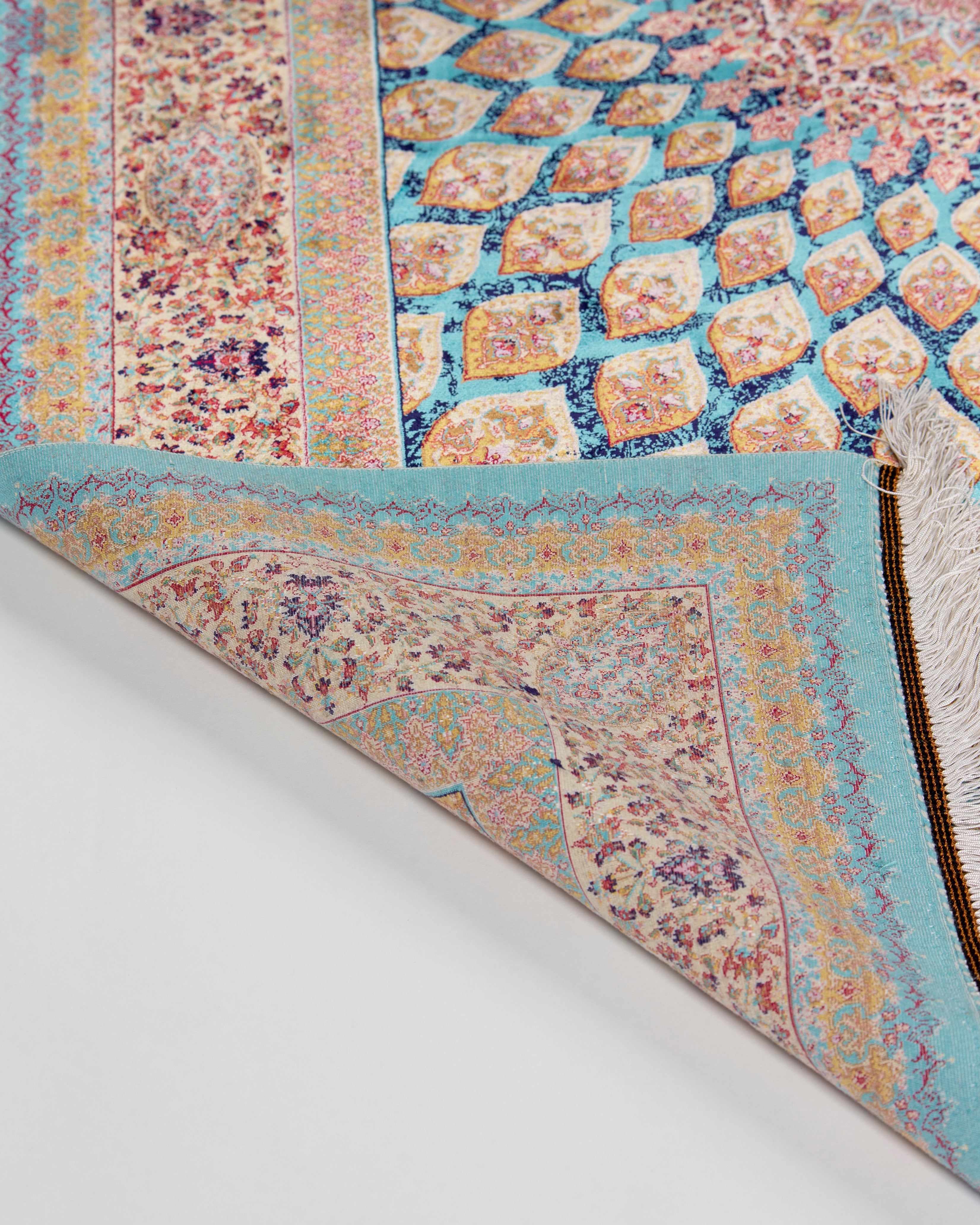 Floral lattice pattern detail of the Firuzeh silk rug