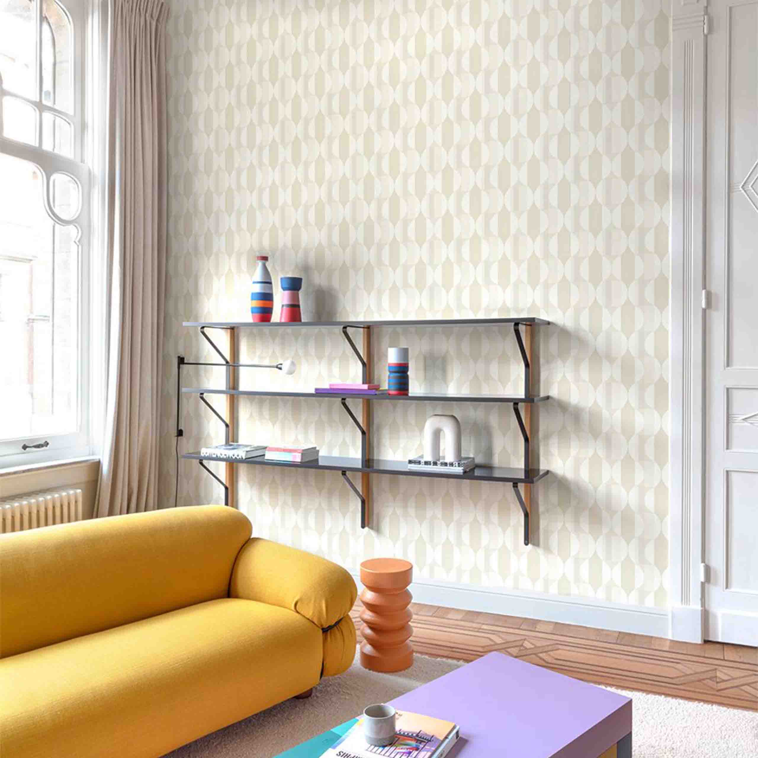 Room interior showcasing a stylish white and cream geometric wallpaper with a sleek and contemporary design.
