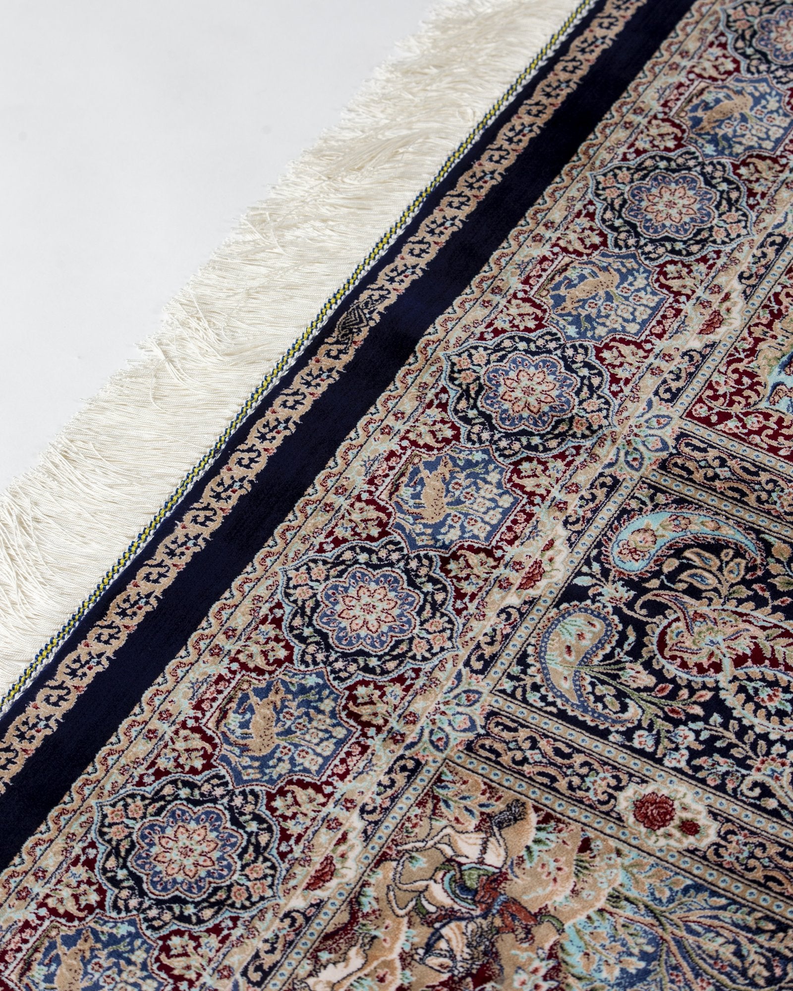 border pattern detail on the Golbahar navy silk rug