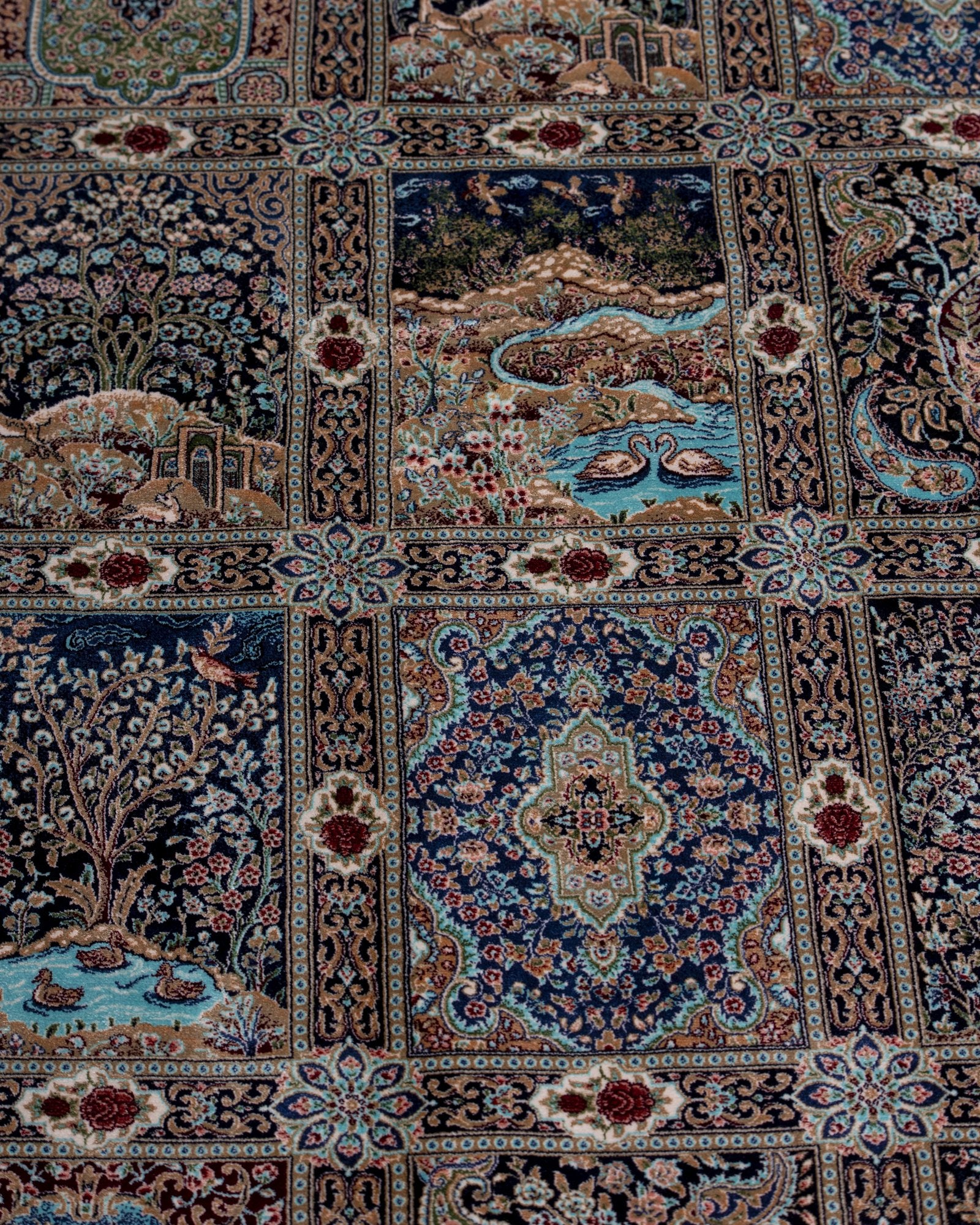 angled view with a fringed end on the Golbahar navy silk rug