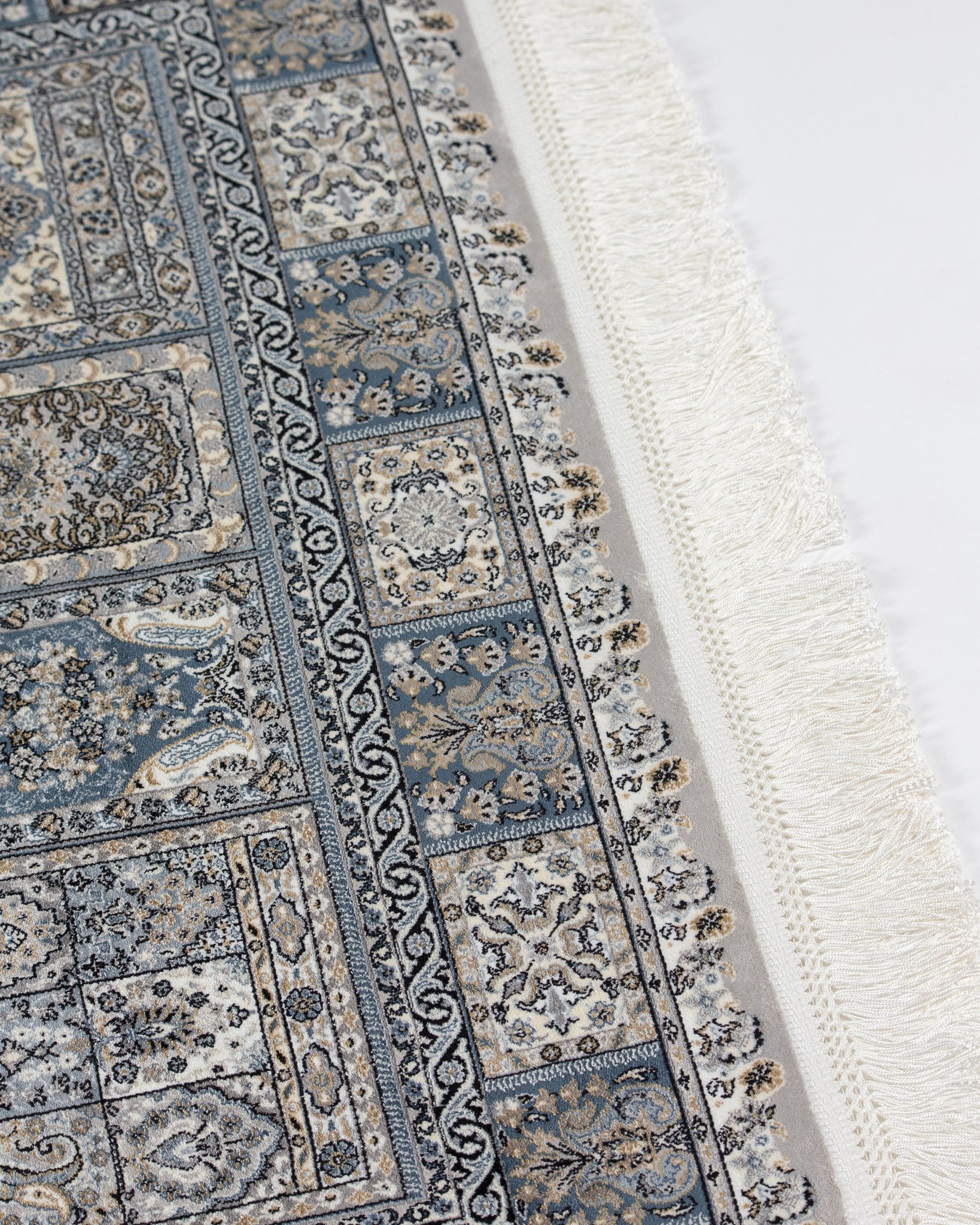 Golestan silk rug panel detail with fringed end