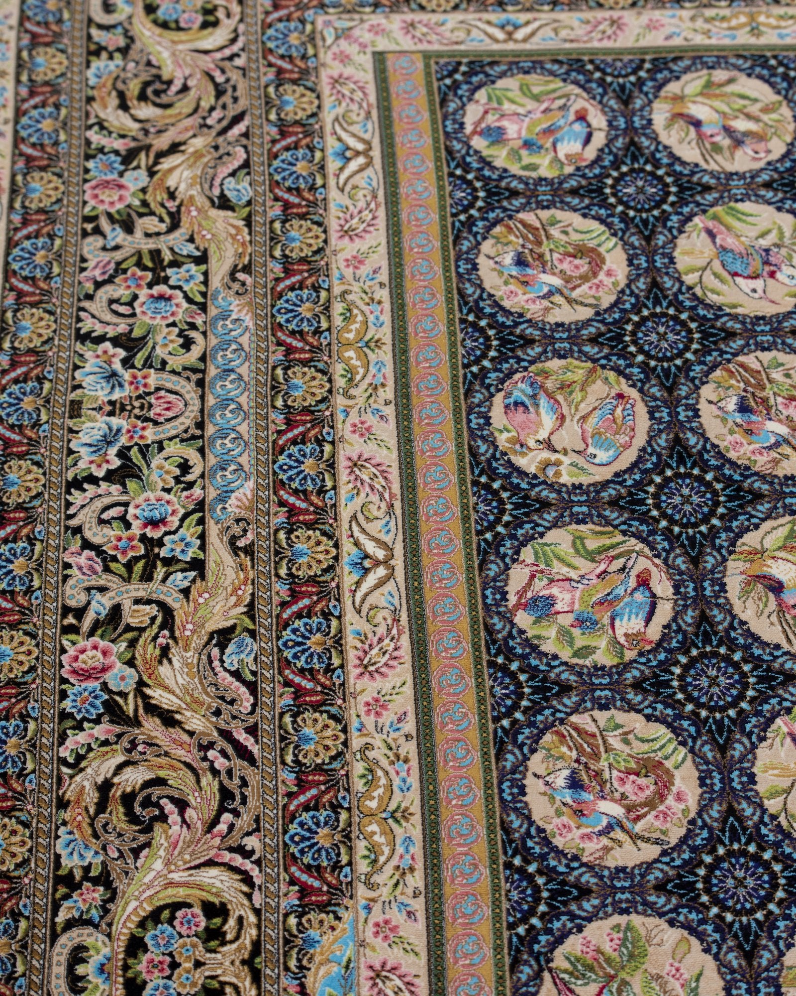 Homa Persian silk rug folded corner showing fine weave, black and gold 200 x 300 cm - Tabeer Homes Dubai