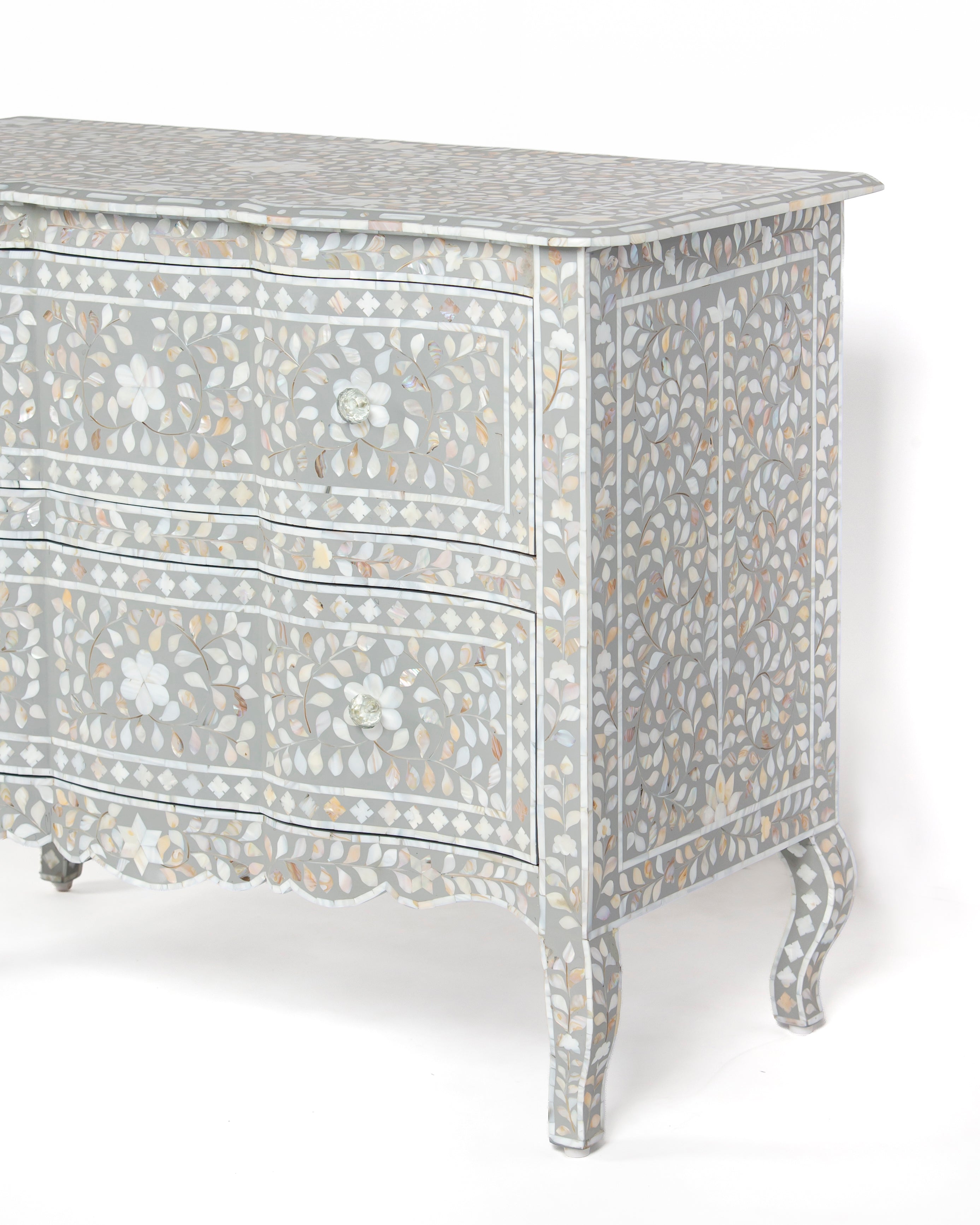 Side view of Iris grey chest of drawers showing mother of pearl leaf inlay