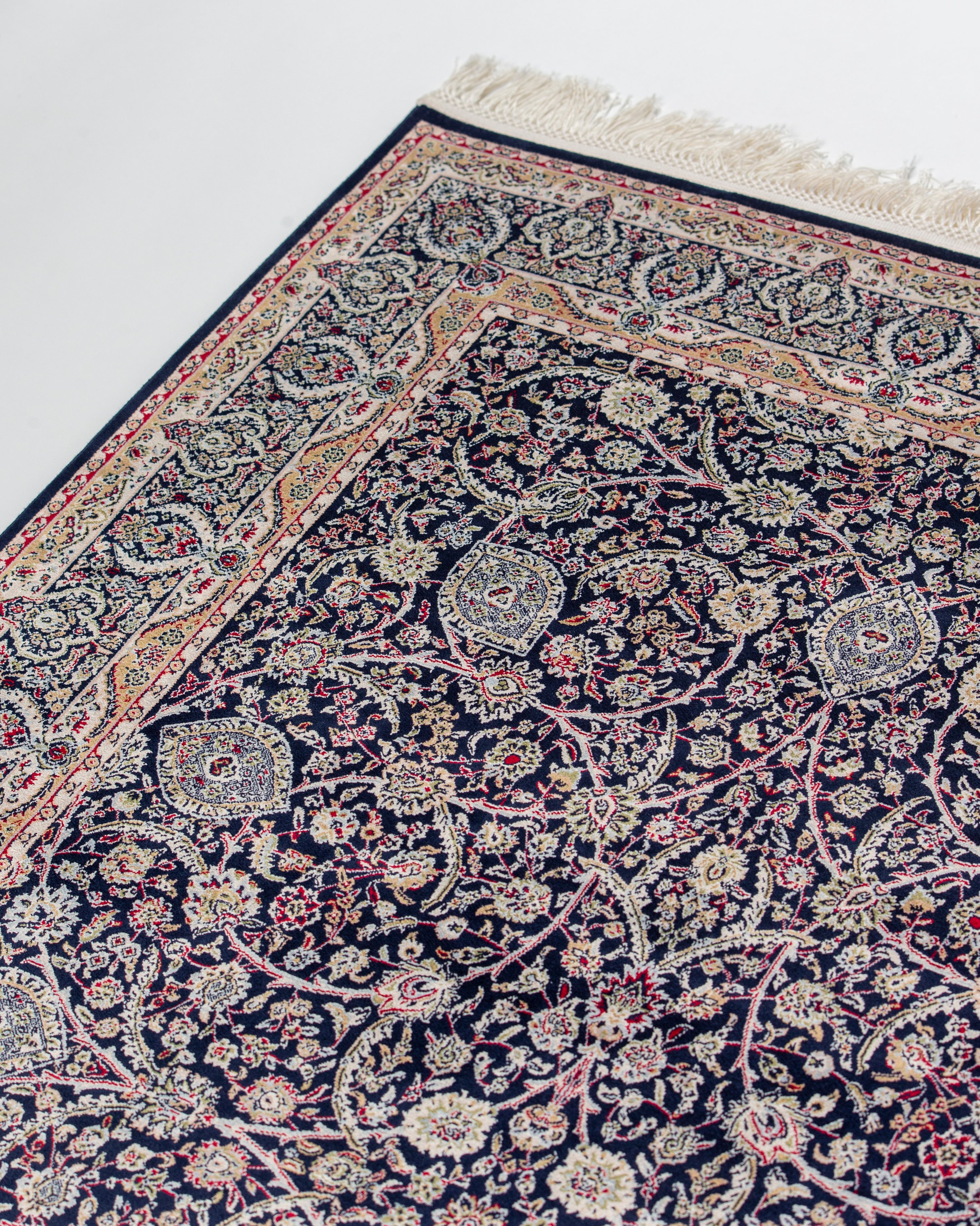 Angled corner view of Layla navy Persian silk rug
