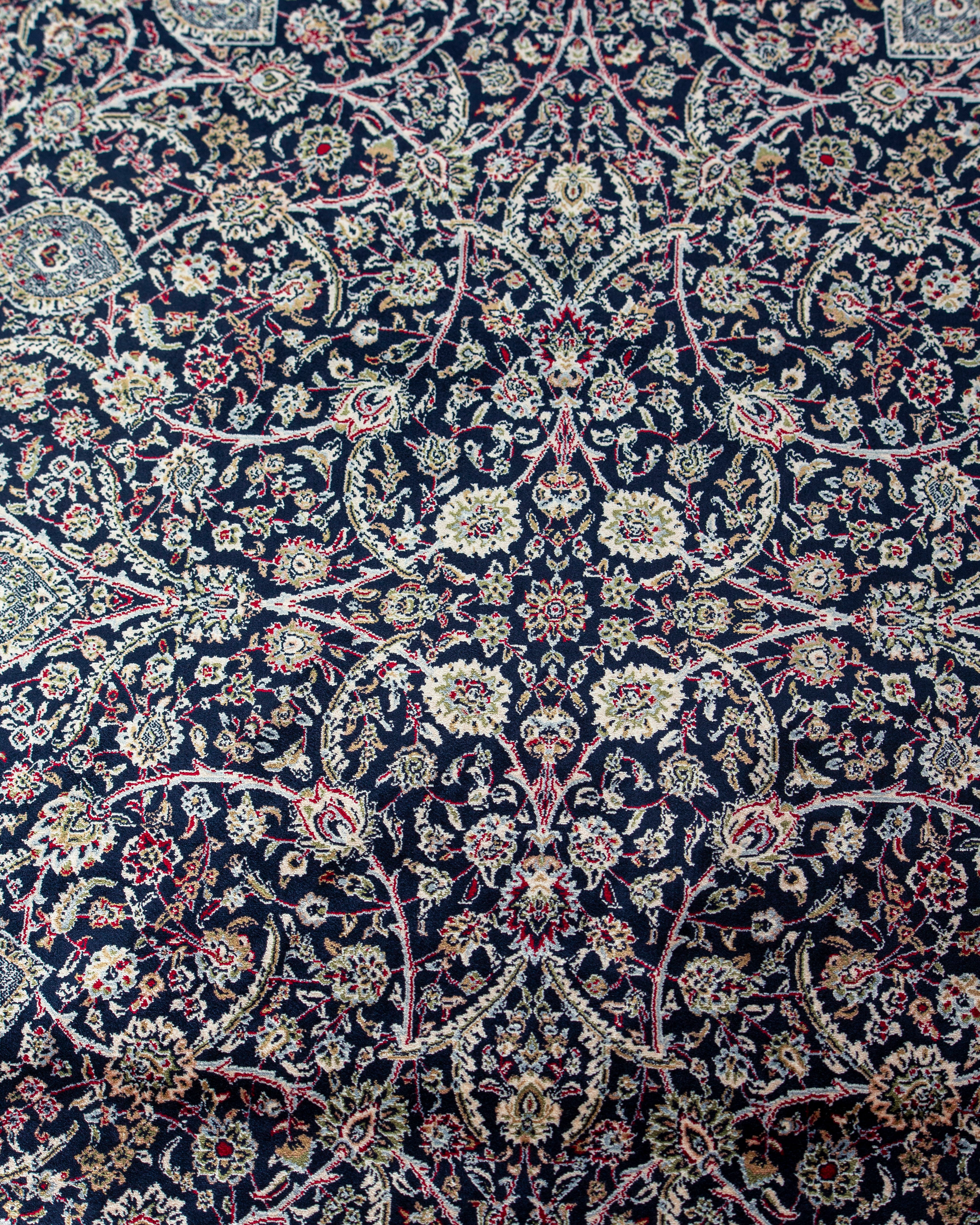 Close up of the navy floral silk pile on the Layla rug