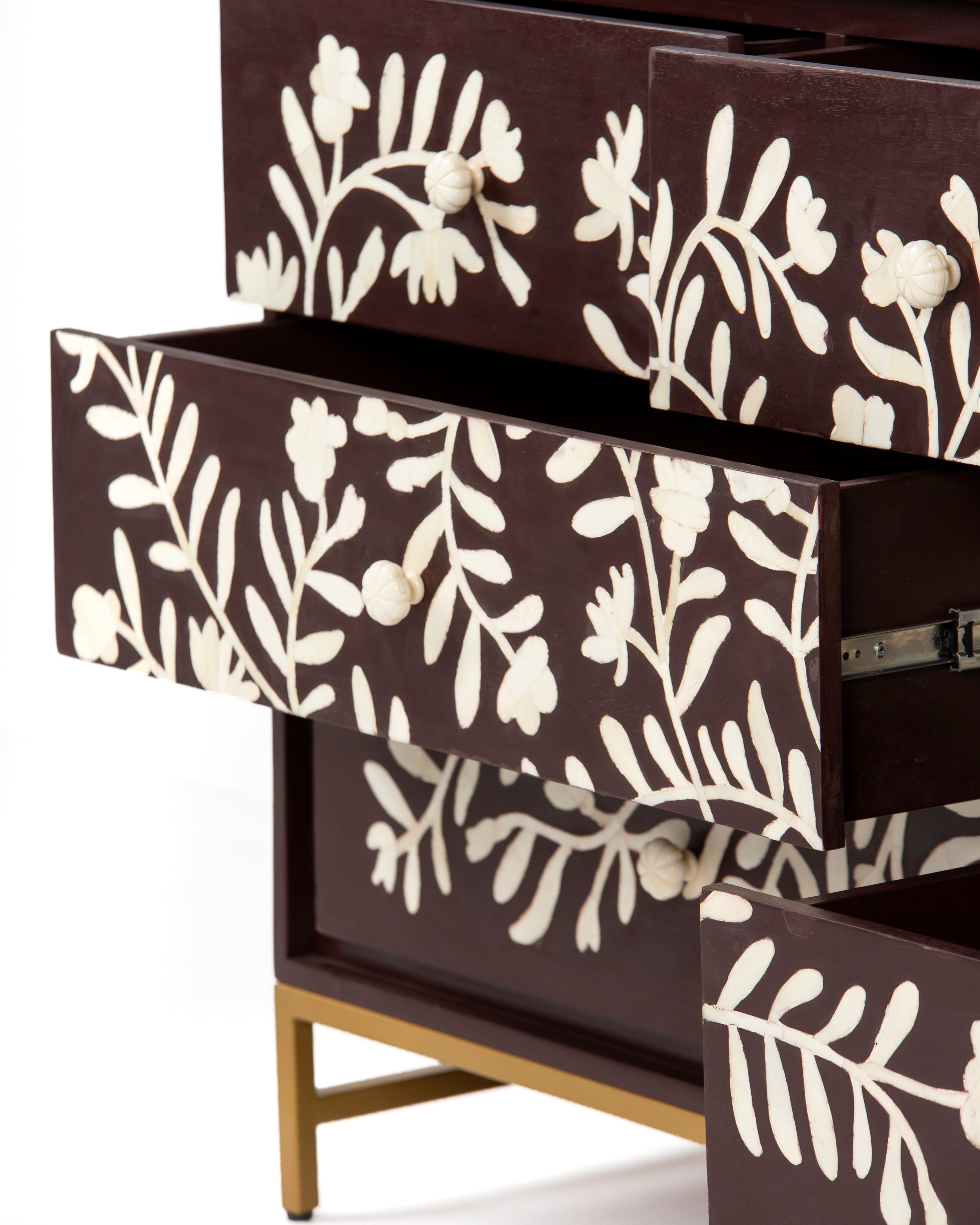 Open drawer detail with bone flower knobs on Luna dresser