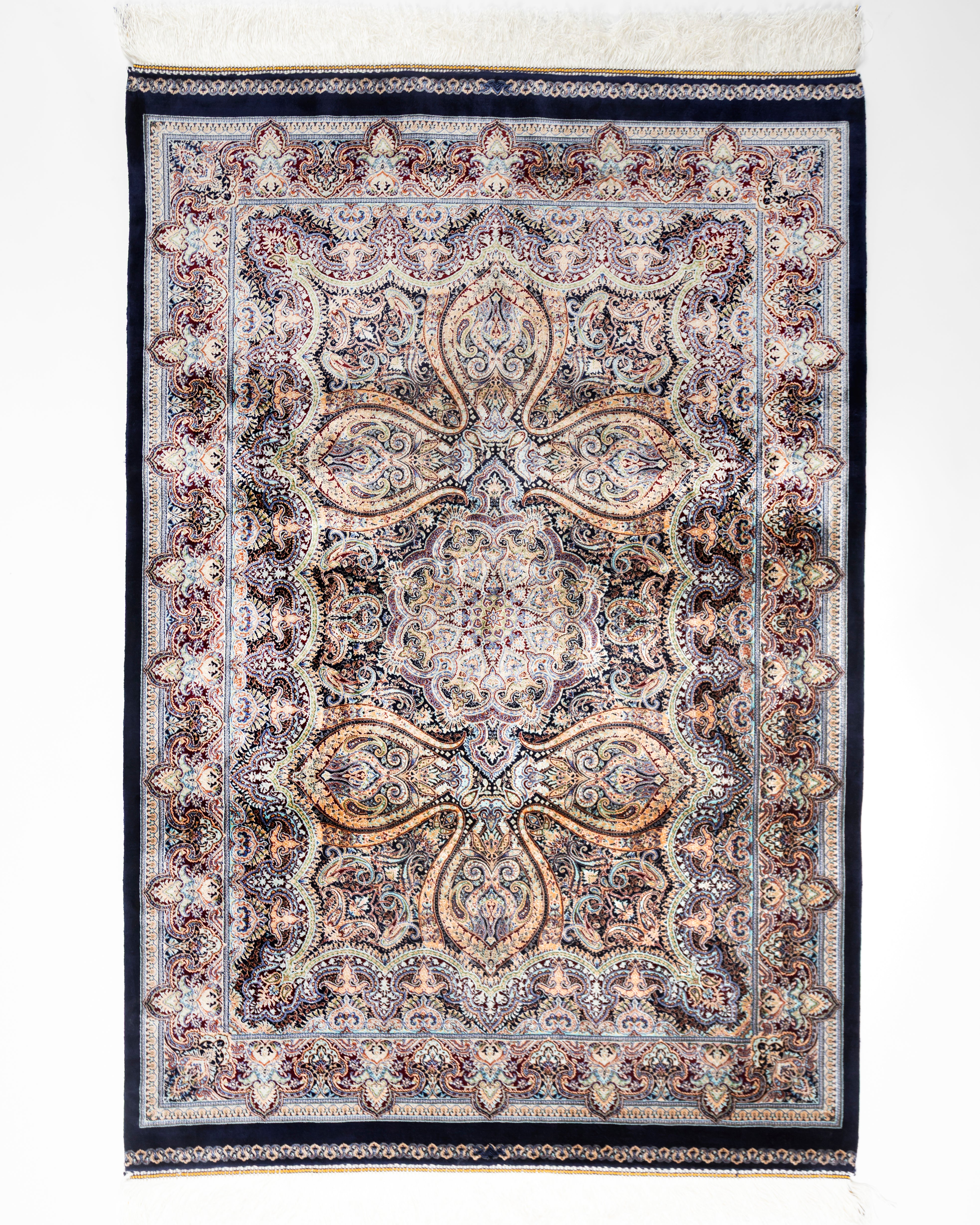Mahtab grey silk rug with a Persian paisley medallion and navy border, full view