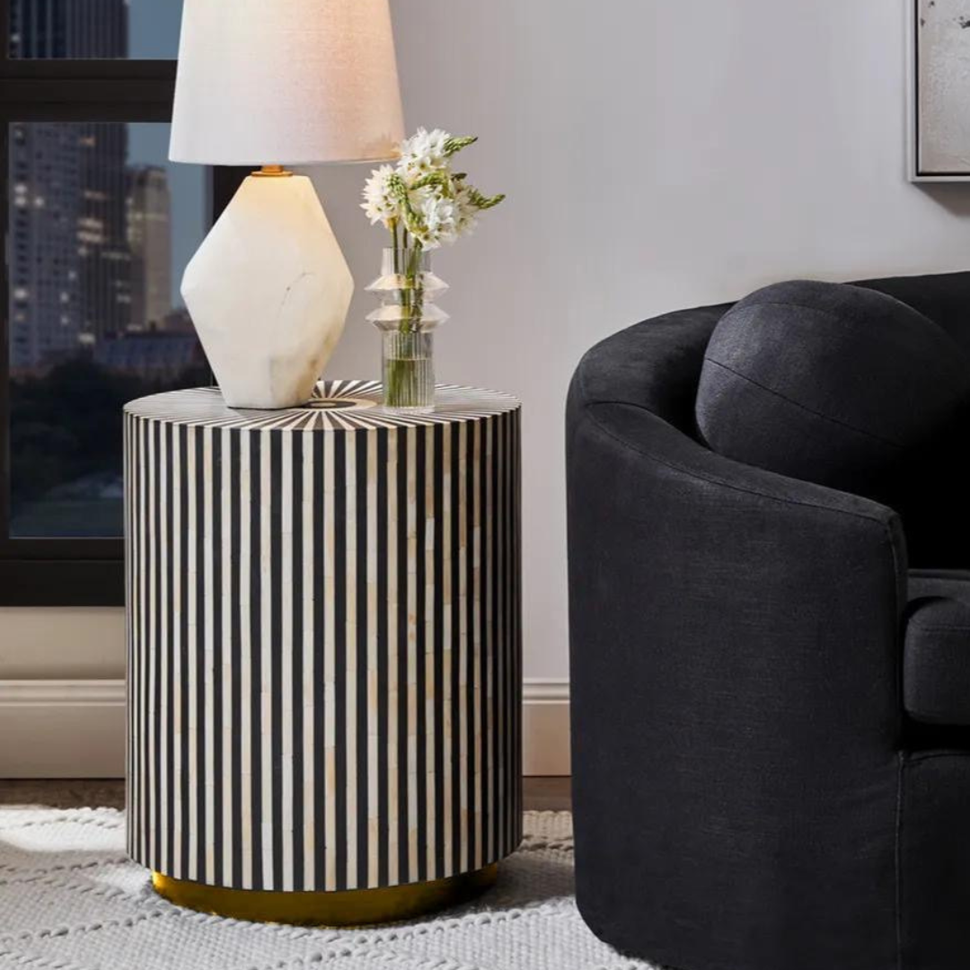 Black bone inlay side table with a striking striped pattern and round top, adding elegance and artistry to modern interiors.