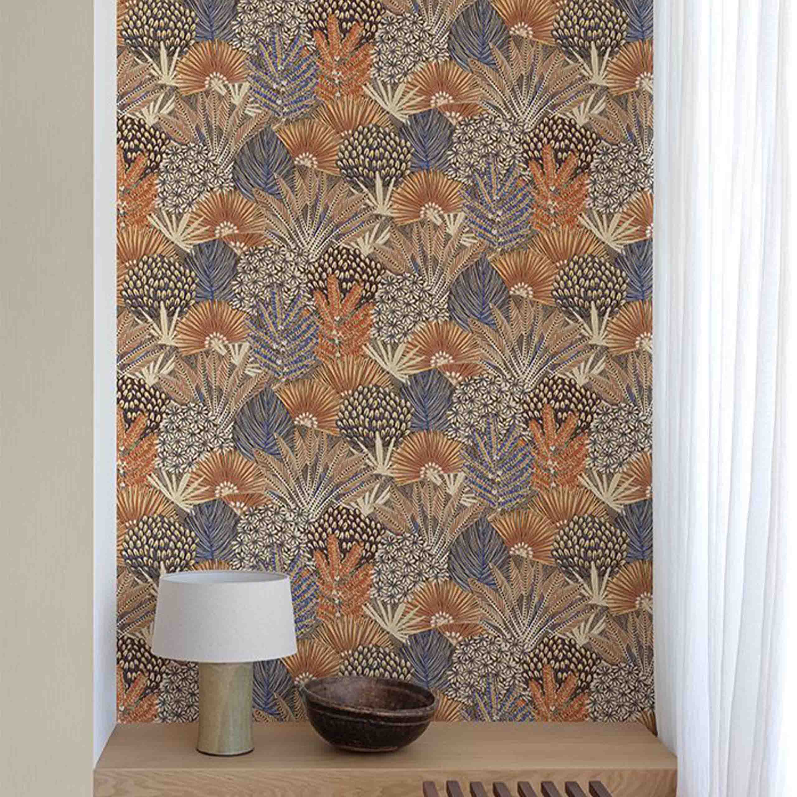 Maranta wallpaper displayed in a modern room, showcasing vibrant floral and botanical designs in blue and orange hues.