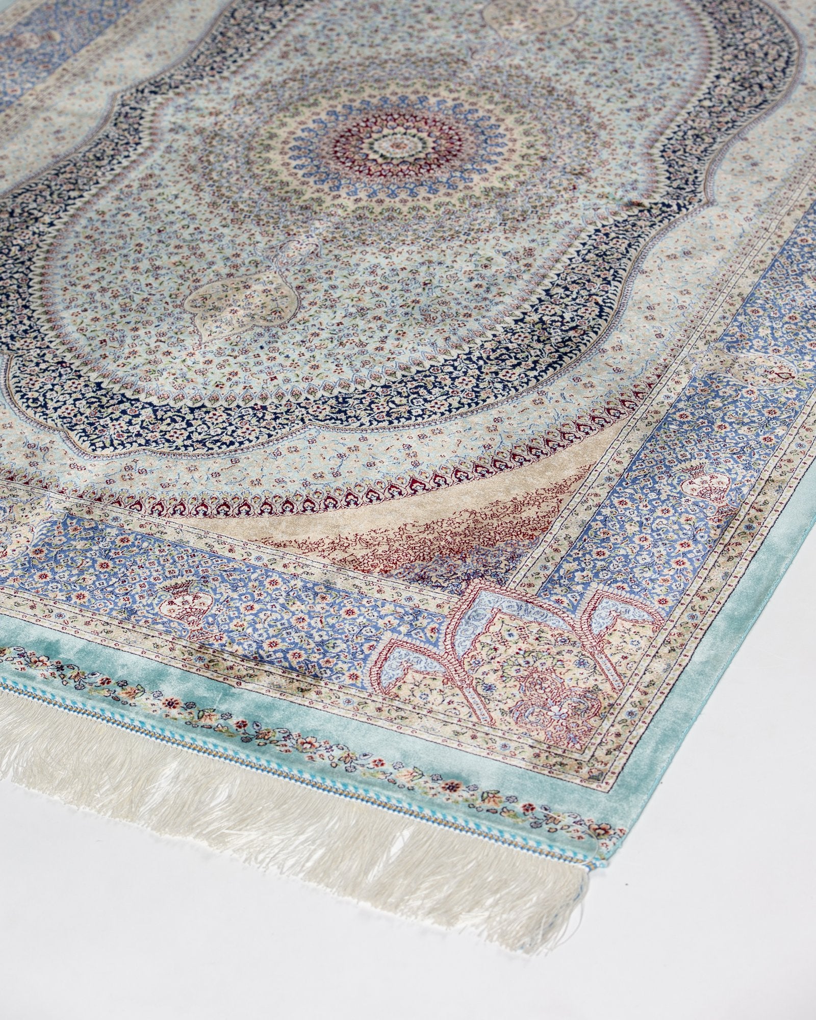 close view of the dome medallion on the Nasrin blue silk rug