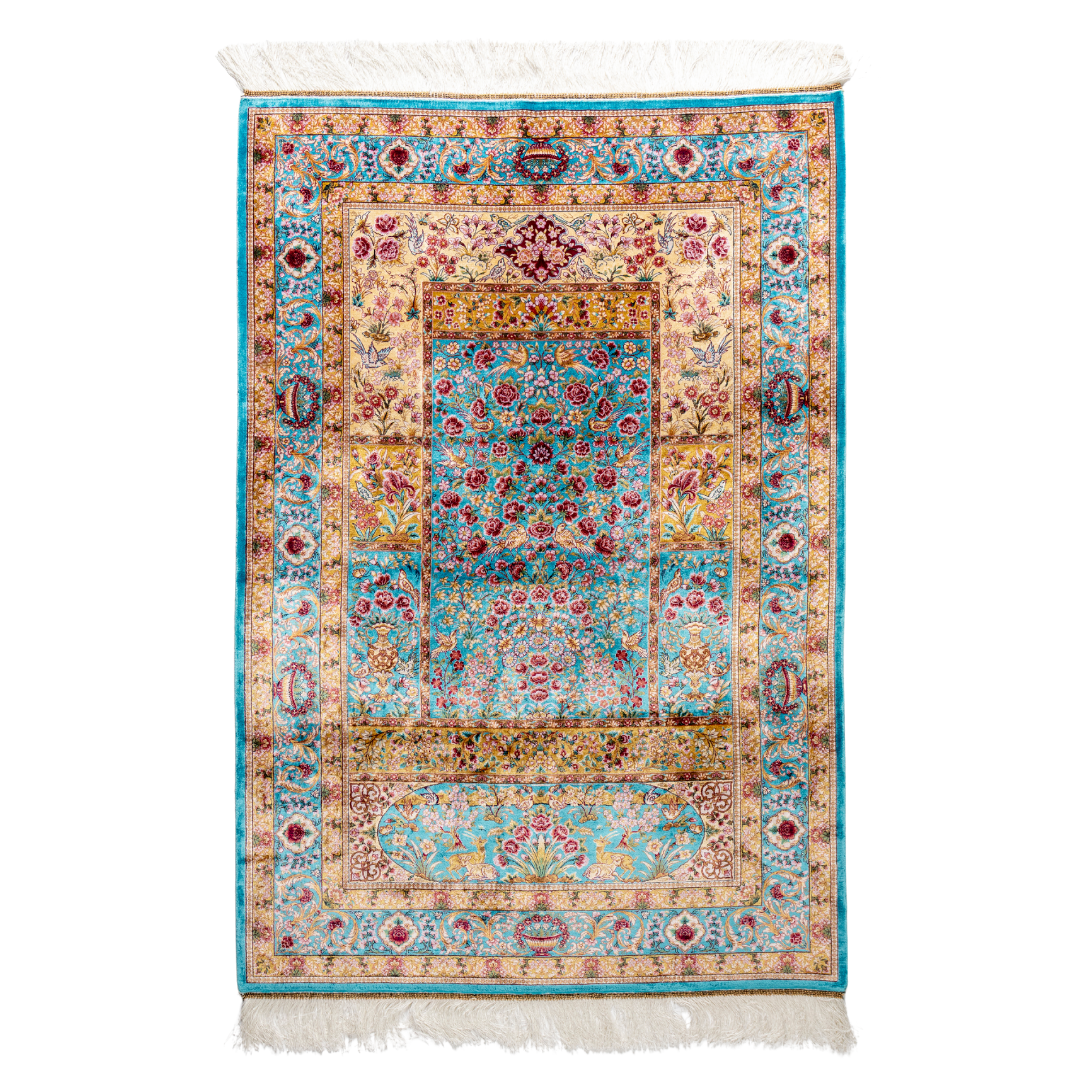 Neriah Silk Rug featuring ruby red floral and bird motifs on an aqua-blue base with golden ornate panels, size 150x100 cm.