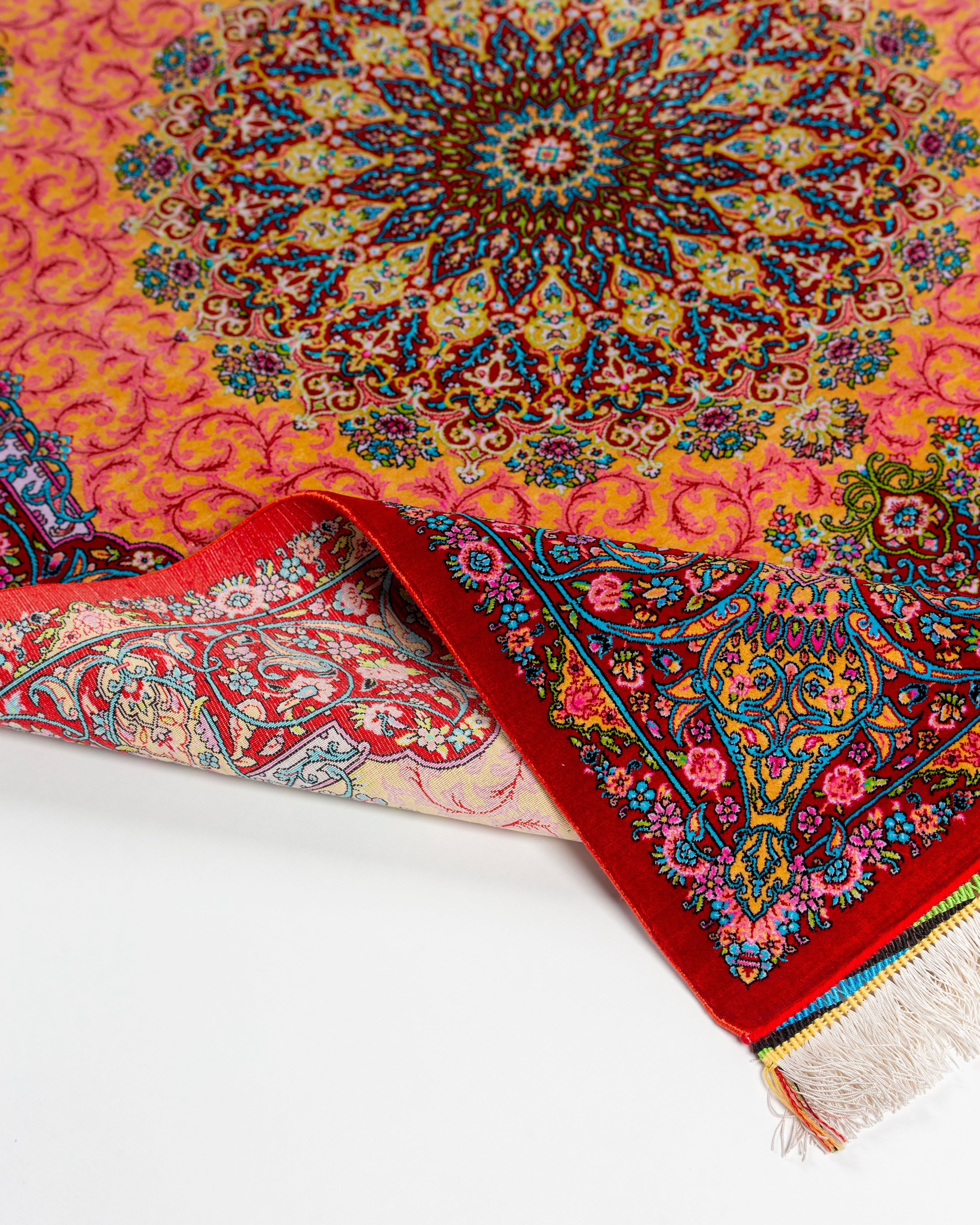 Corner detail of the Noor coral silk rug