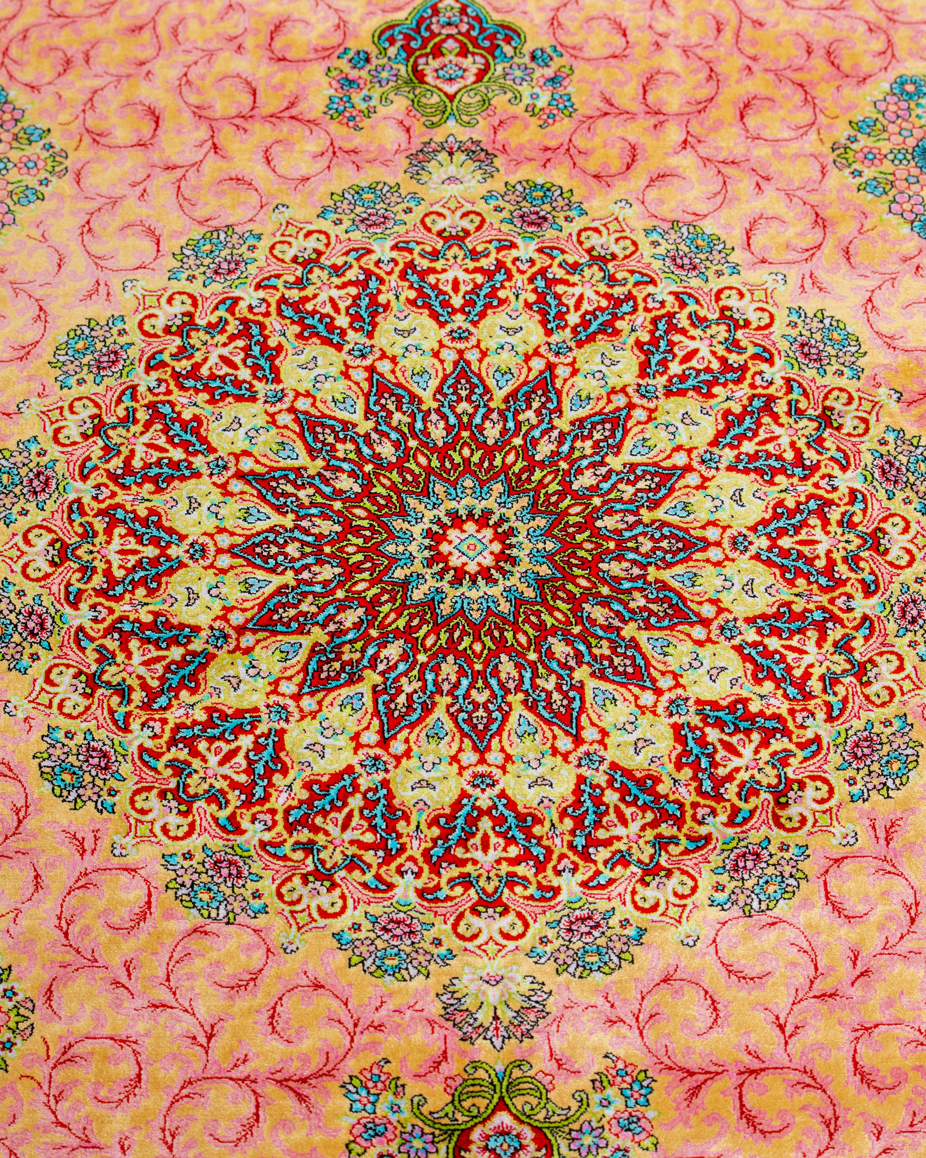 Floral field detail of the Noor coral Persian silk rug