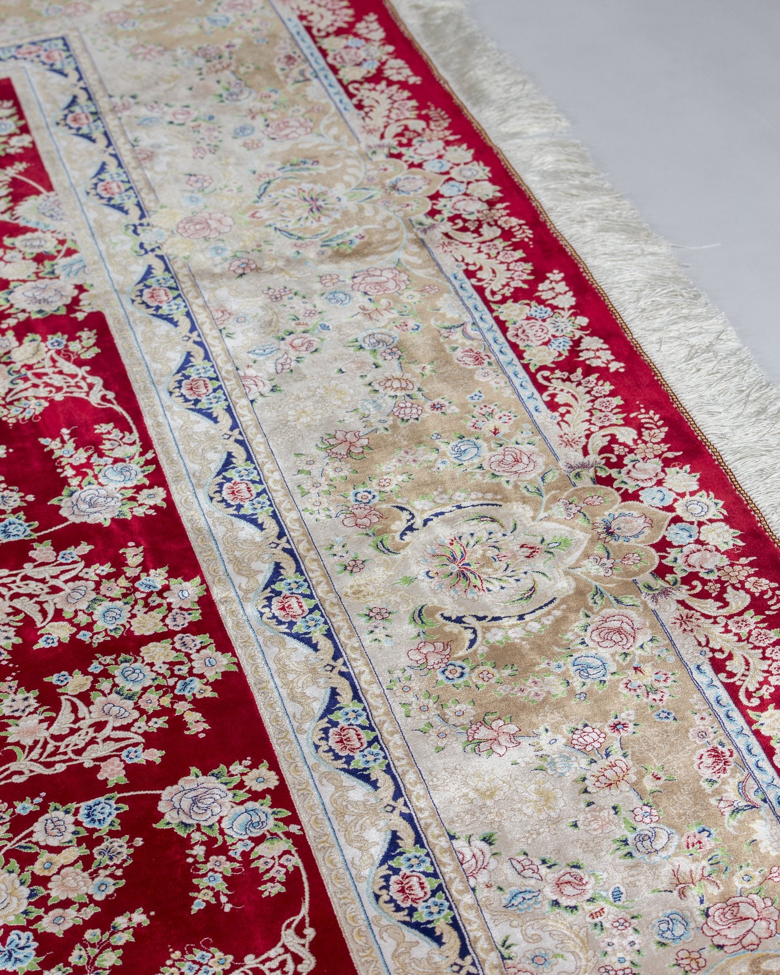 Octavia silk carpet angled view showing deep red tones, 300 x 400 cm - Tabeer Homes Dubai