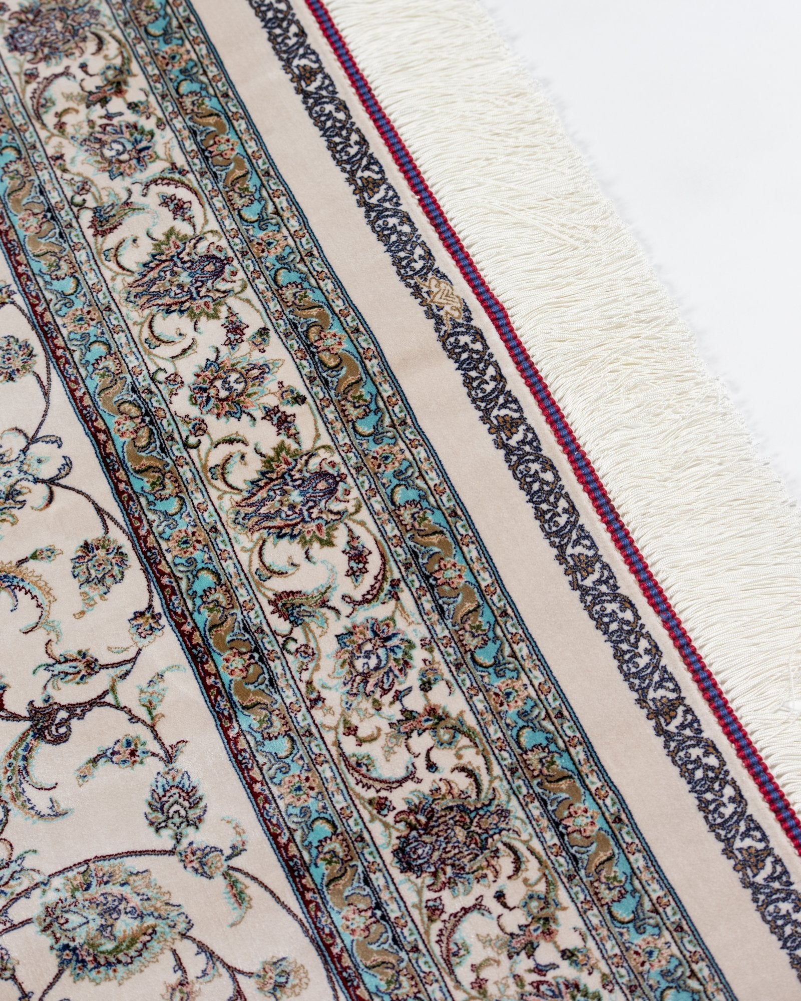border pattern detail on the Parisa ivory silk rug
