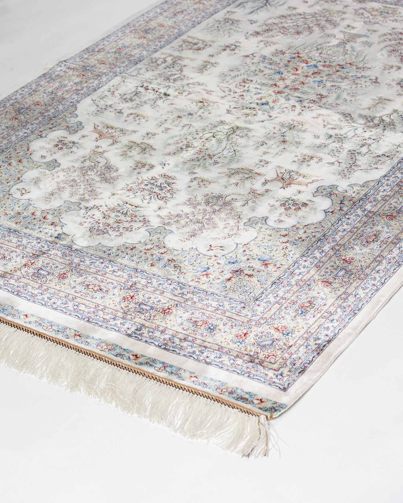 close view of the tree of life on the Parvaneh ivory silk rug