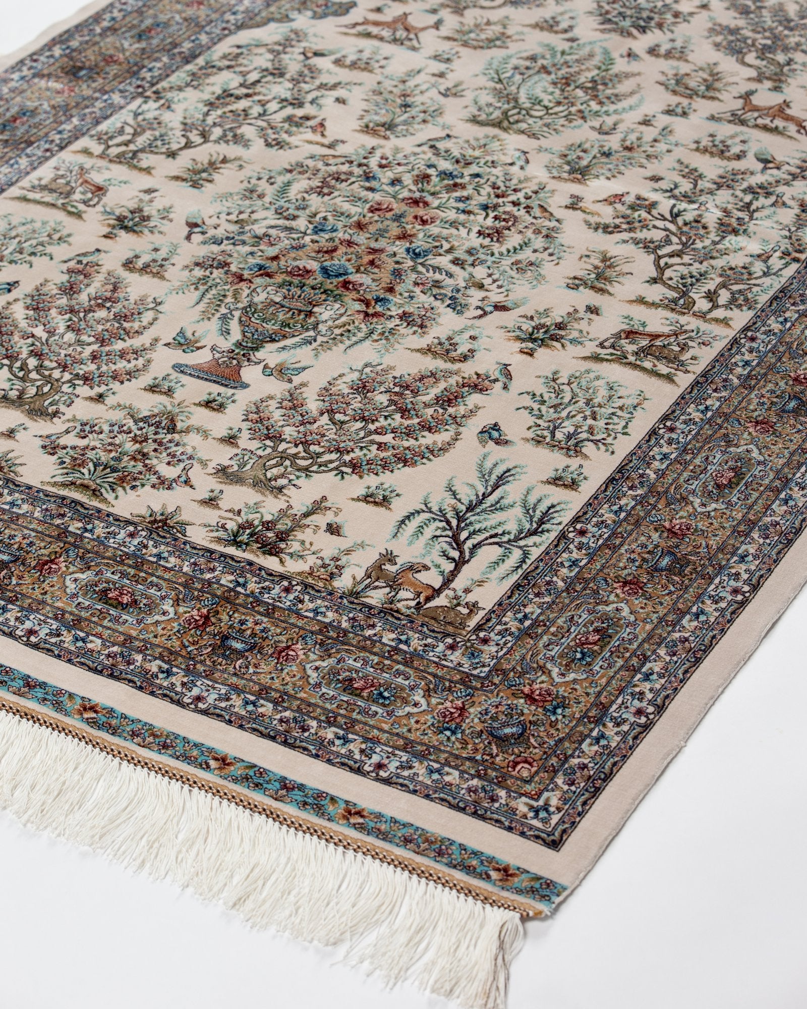 detail of the tree of life on the Parvaneh ivory silk rug