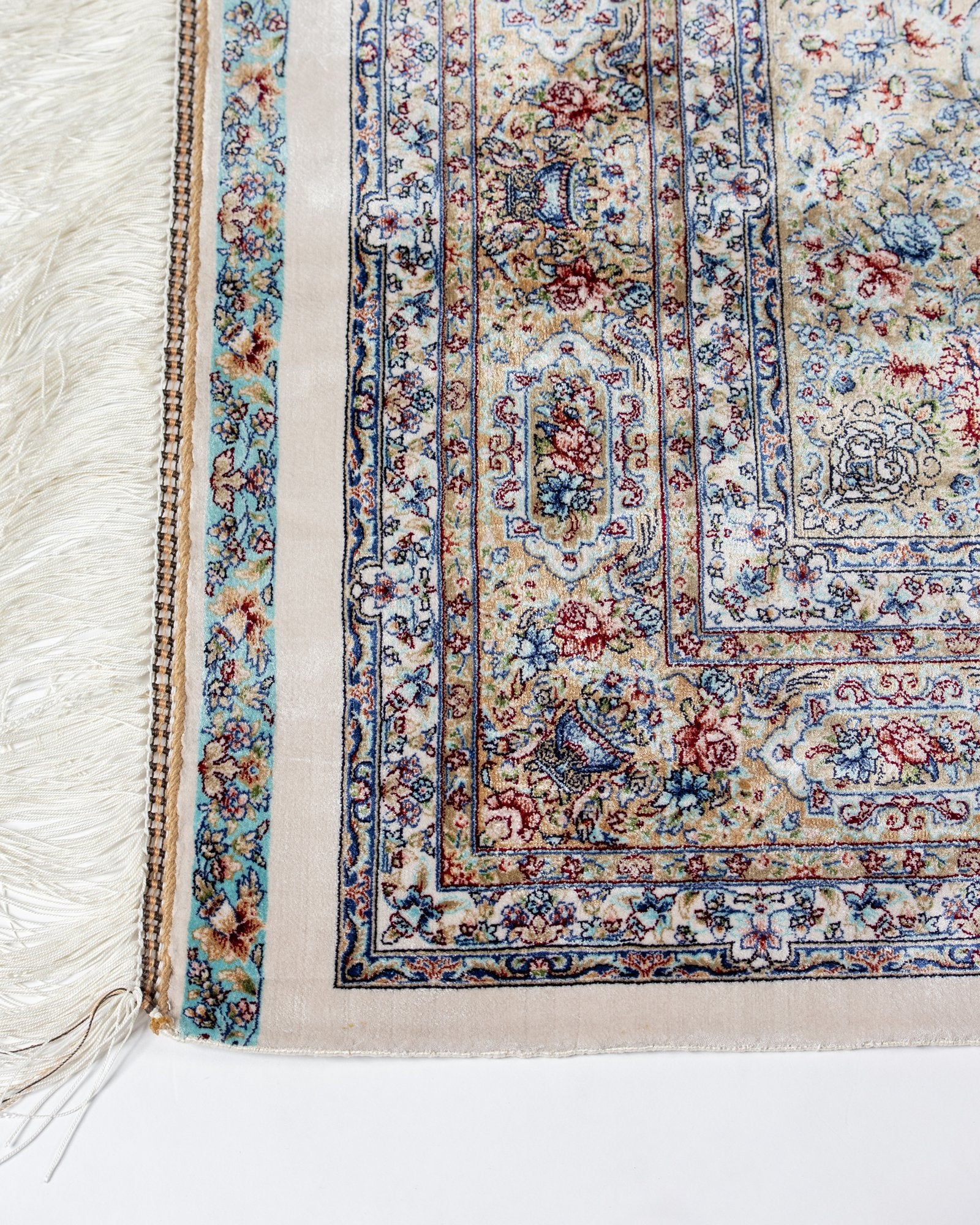 border and field detail on the Parvaneh ivory silk rug