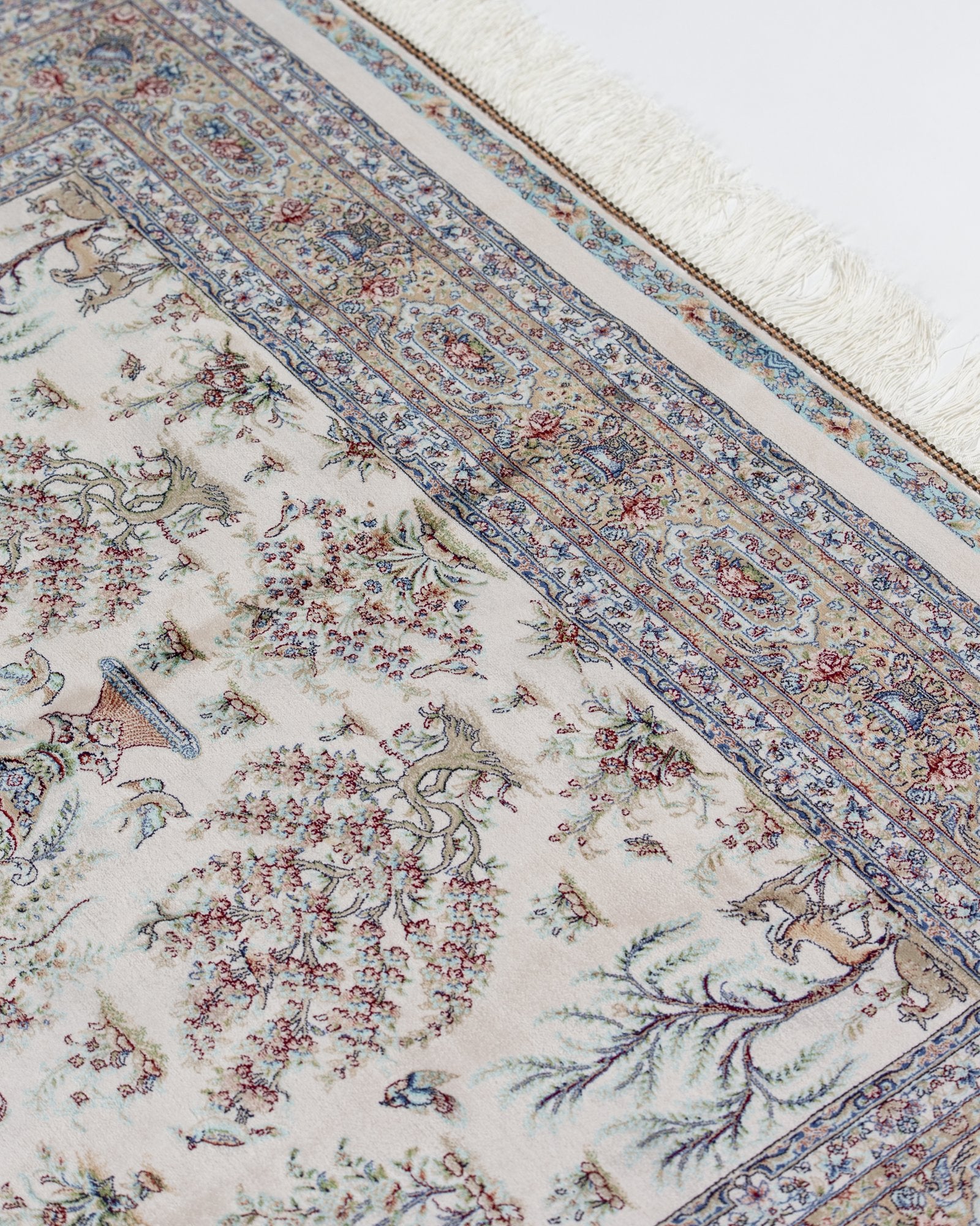 border pattern detail on the Parvaneh ivory silk rug