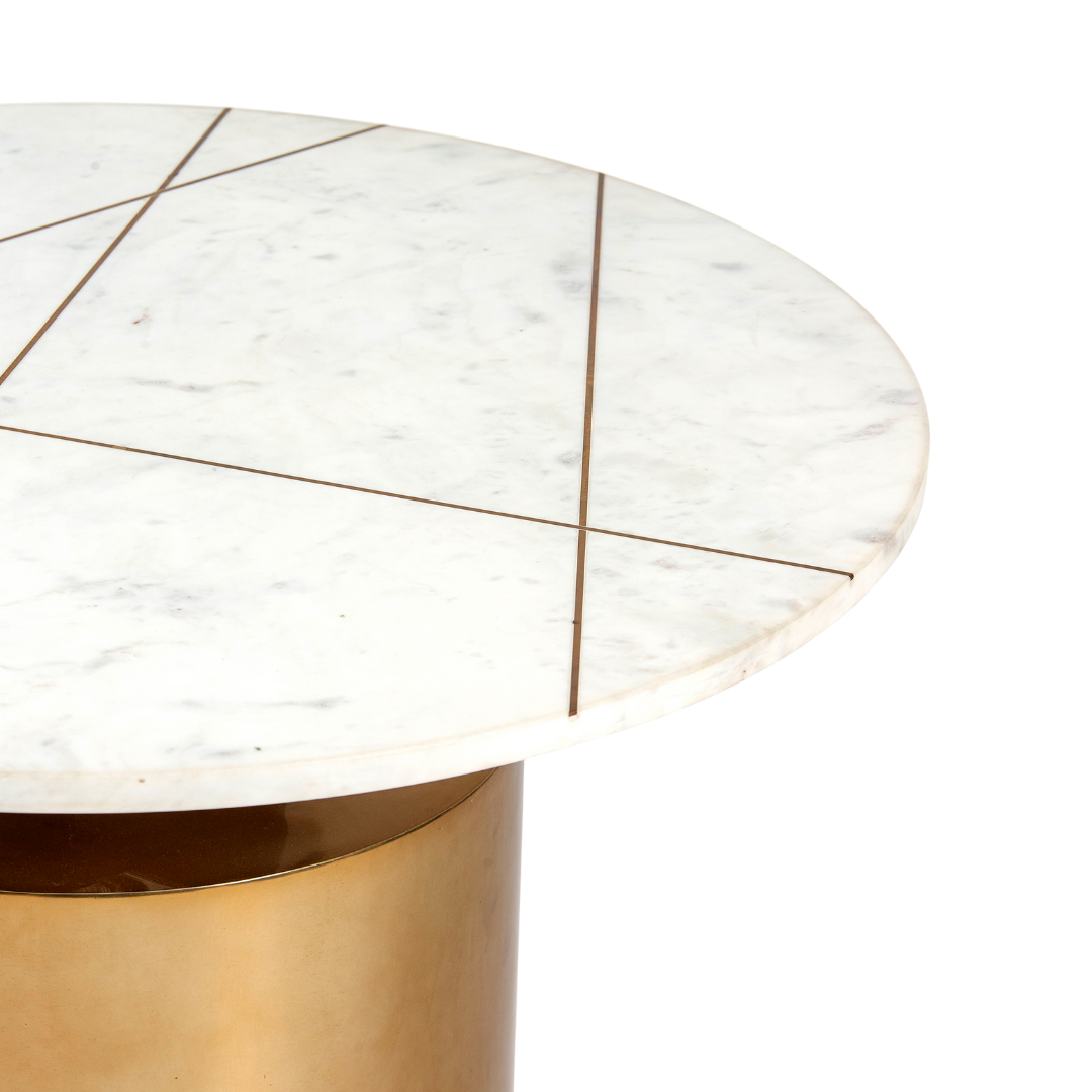 White marble coffee table with golden cylindrical base and linear inlay accents