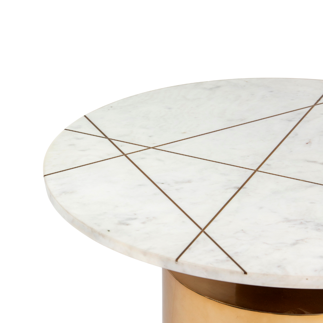 White marble coffee table with golden cylindrical base and linear inlay accents