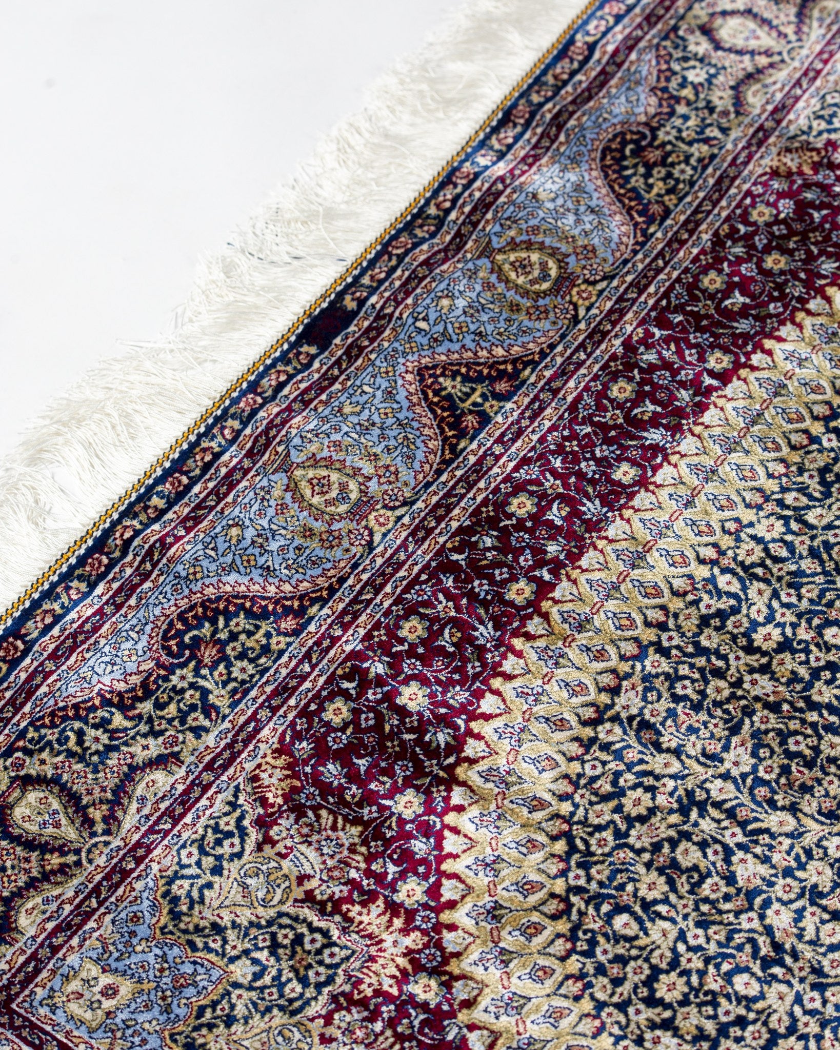 Roya silk rug field and border detail