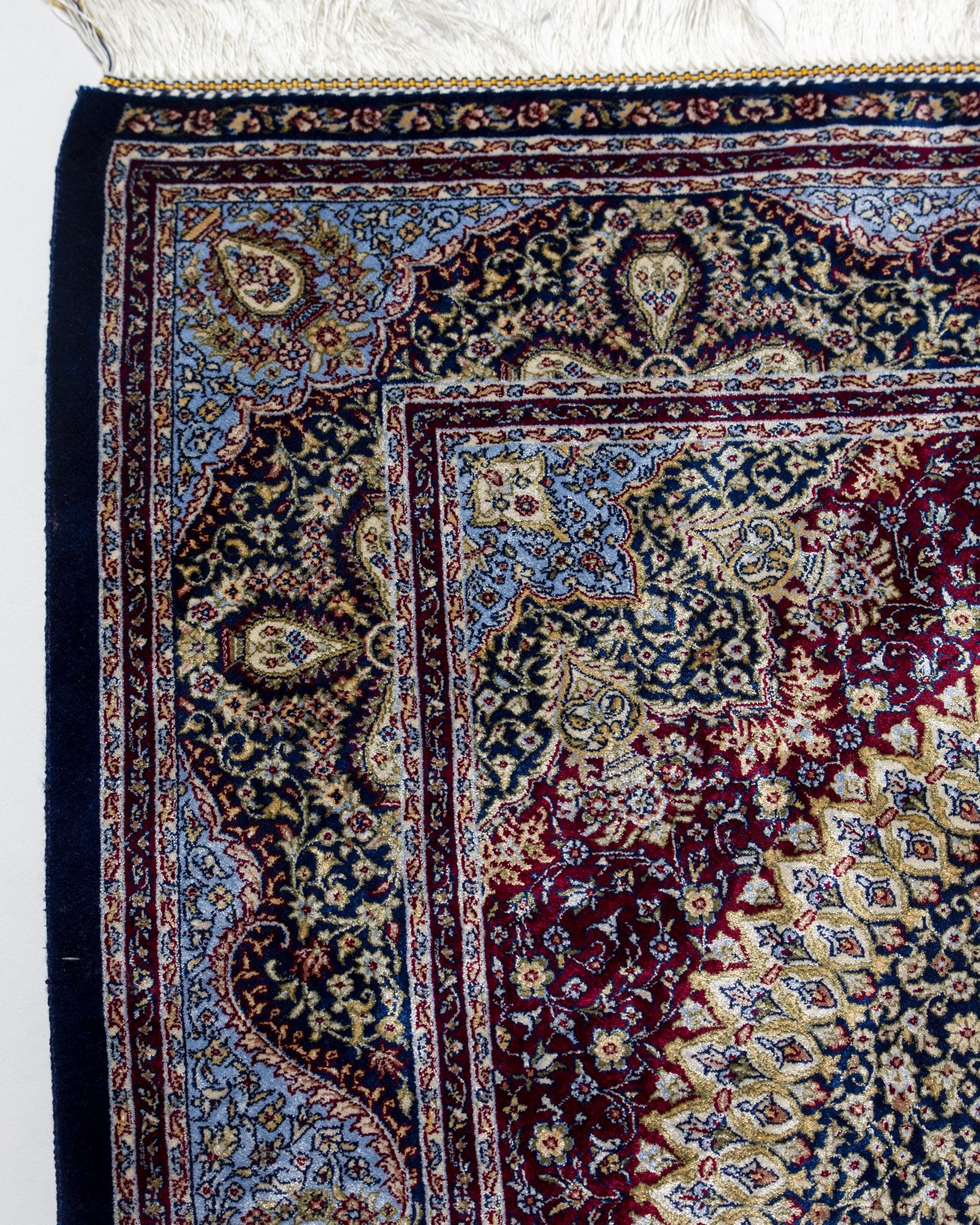 Corner of the Roya sage green silk rug