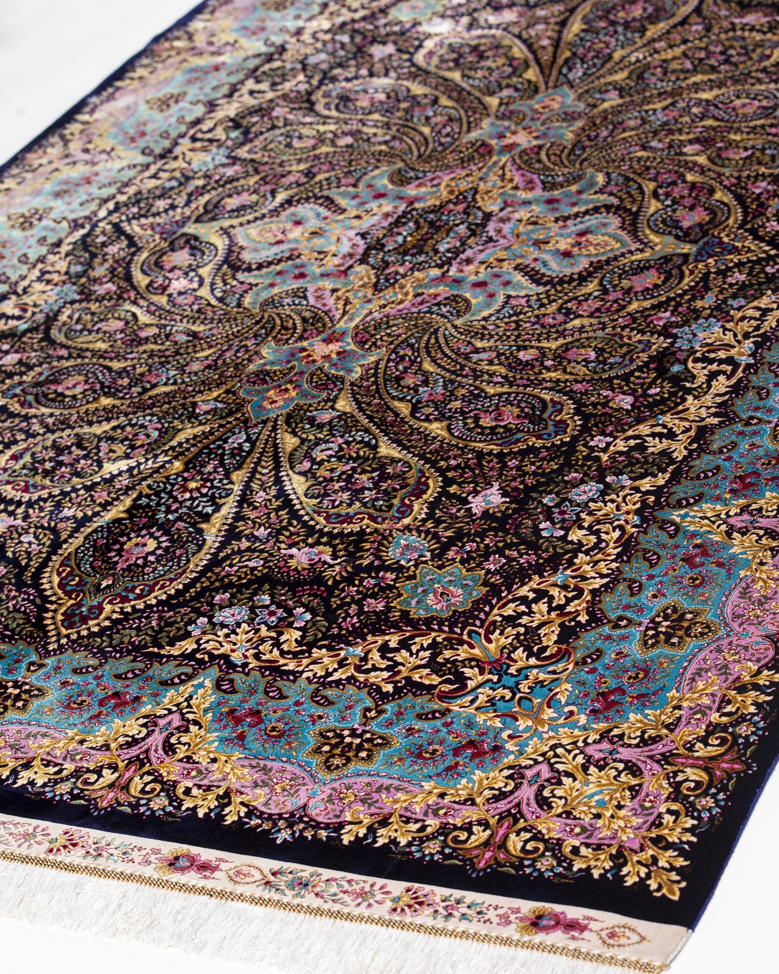 close view of the paisley design on the Selene charcoal silk rug