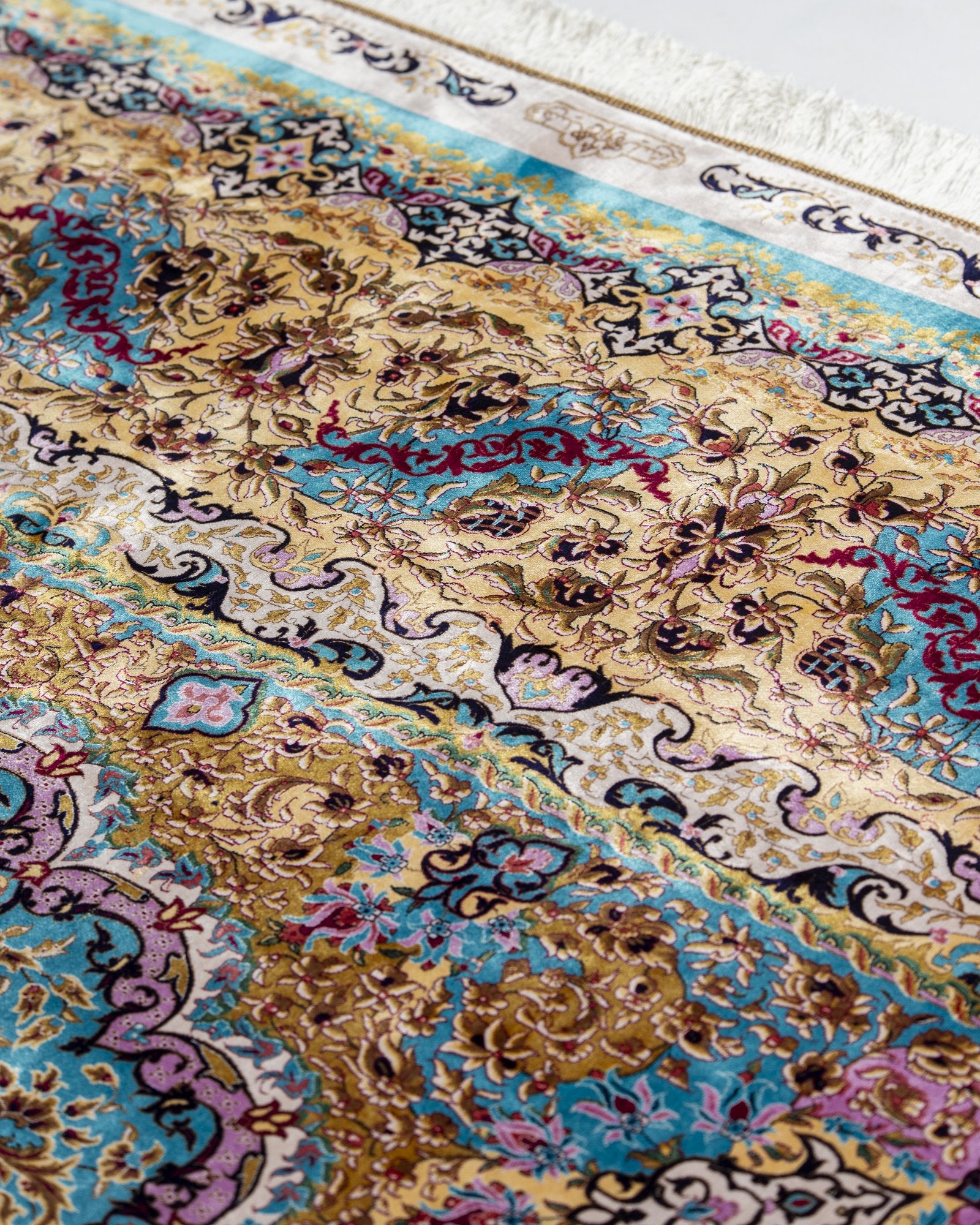 Sepideh silk carpet angled view showing celadon blue tones, 250 x 350 cm - Tabeer Homes Dubai