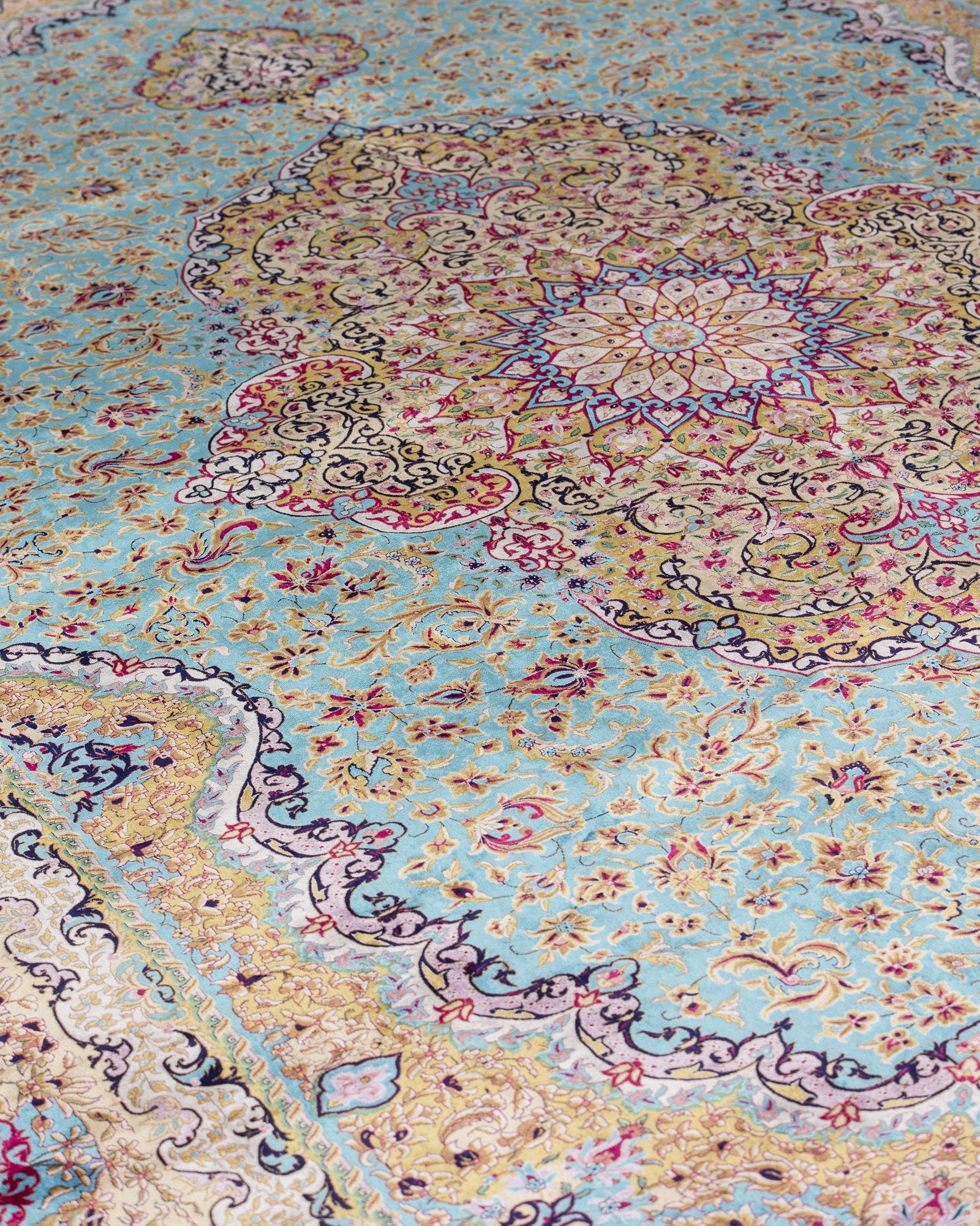 Sepideh Persian silk rug folded corner showing fine weave, celadon blue 250 x 350 cm - Tabeer Homes Dubai