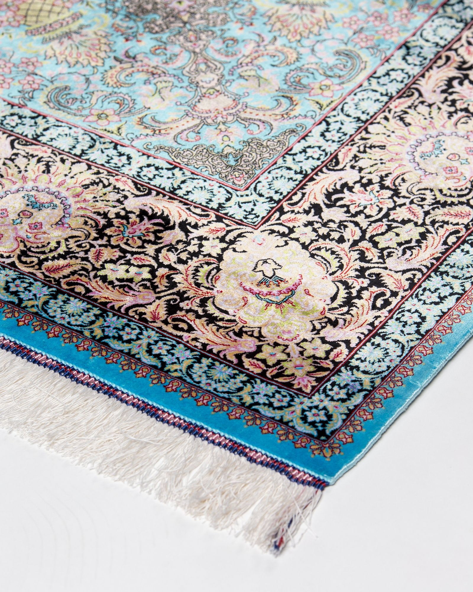 border pattern detail on the Serena turquoise silk rug