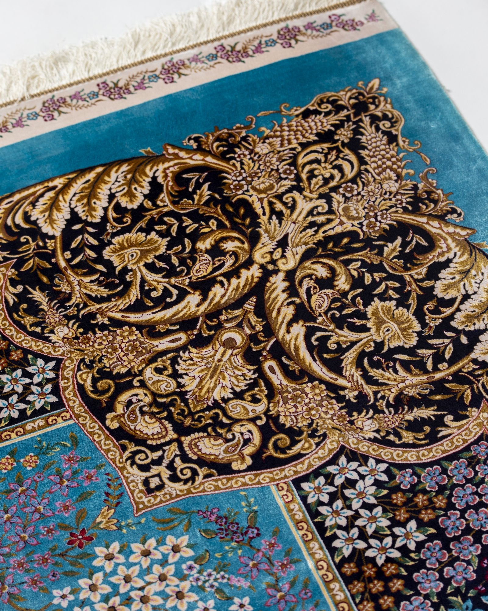 Shahnaz Persian silk rug folded corner showing fine weave, turquoise 200 x 300 cm - Tabeer Homes Dubai