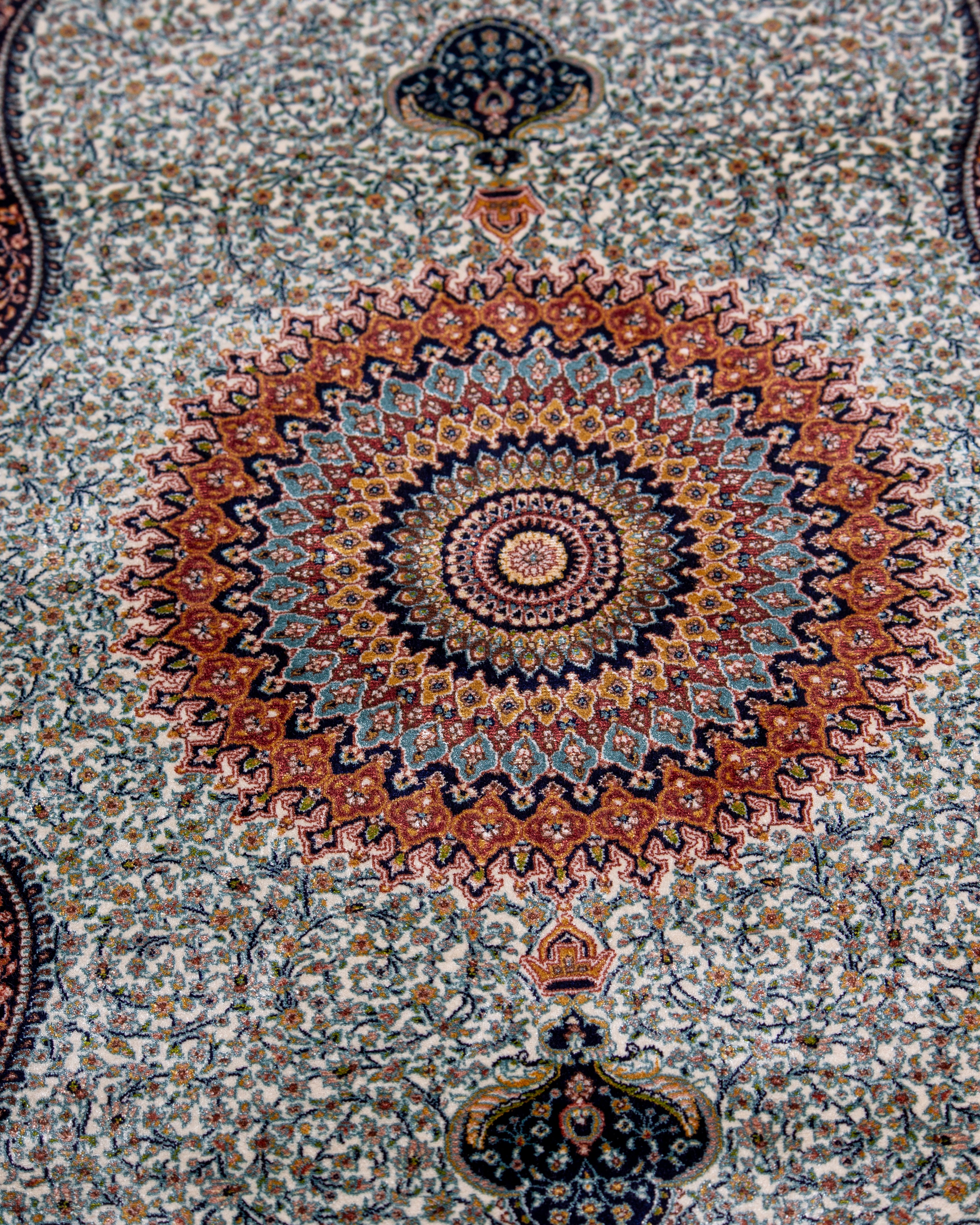 Field and floral detail of the Simin silk rug