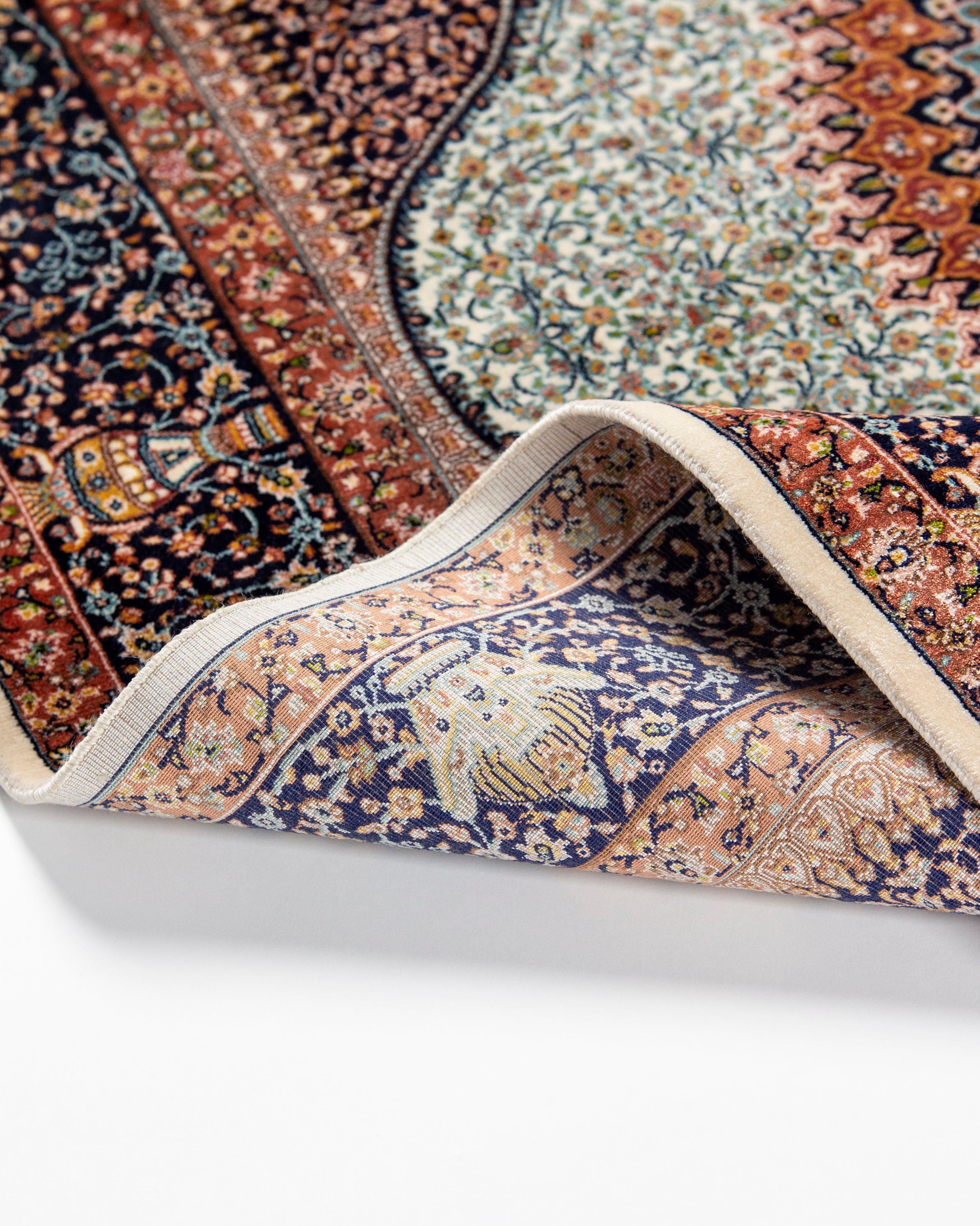 Floral field detail of the Simin silk rug