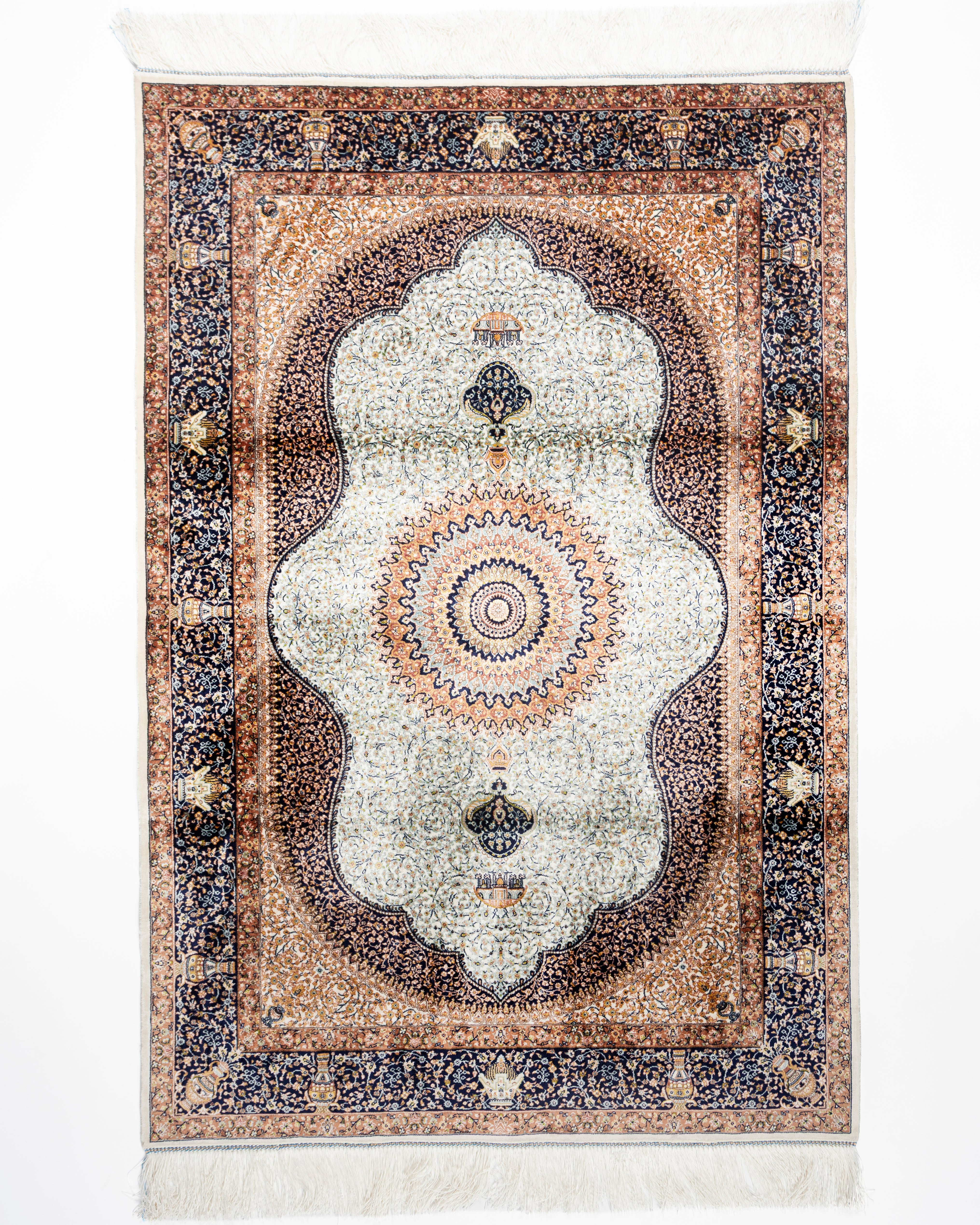 Simin ivory silk rug with a Persian medallion and navy border, full view