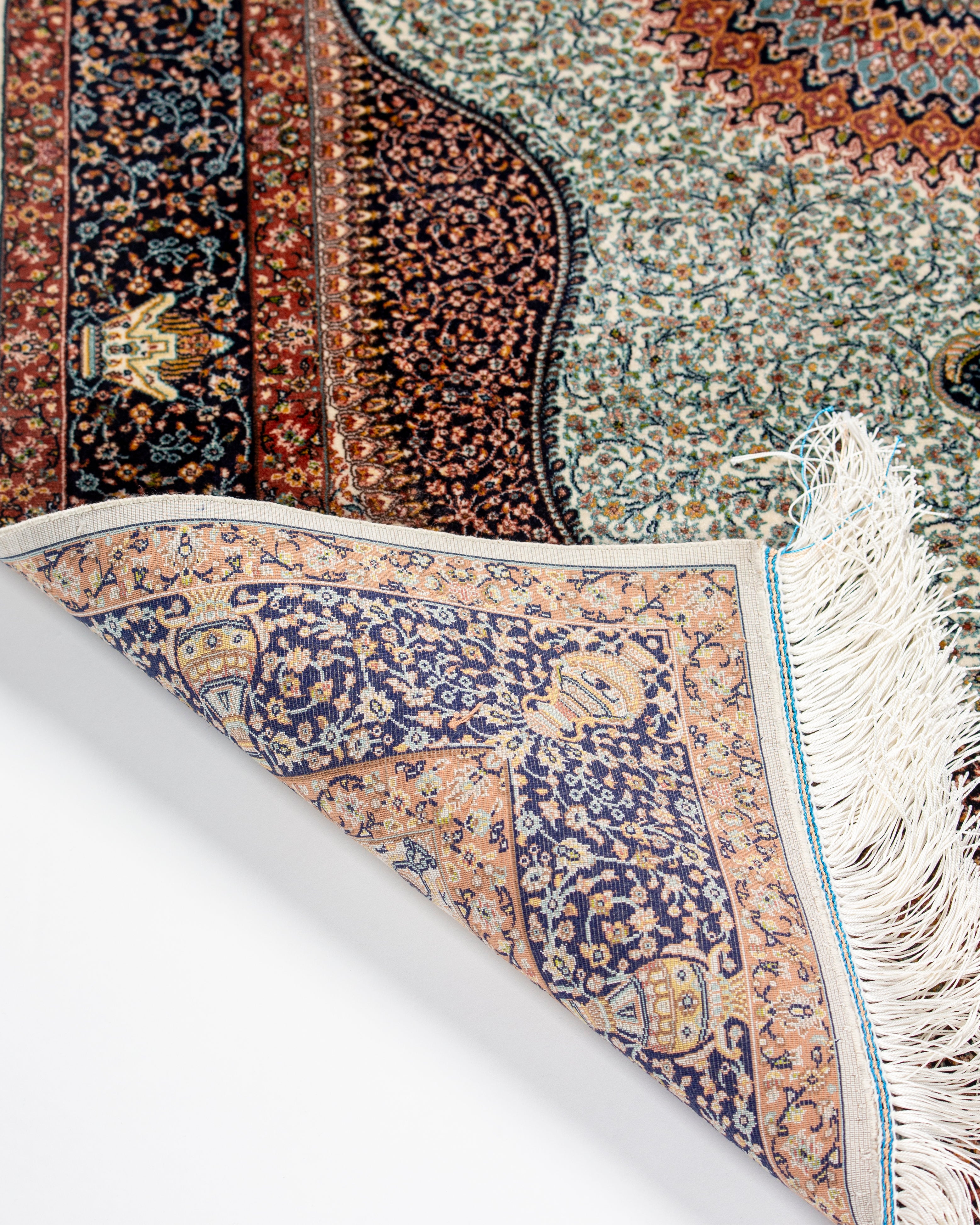 Medallion and field detail of the Simin ivory silk rug