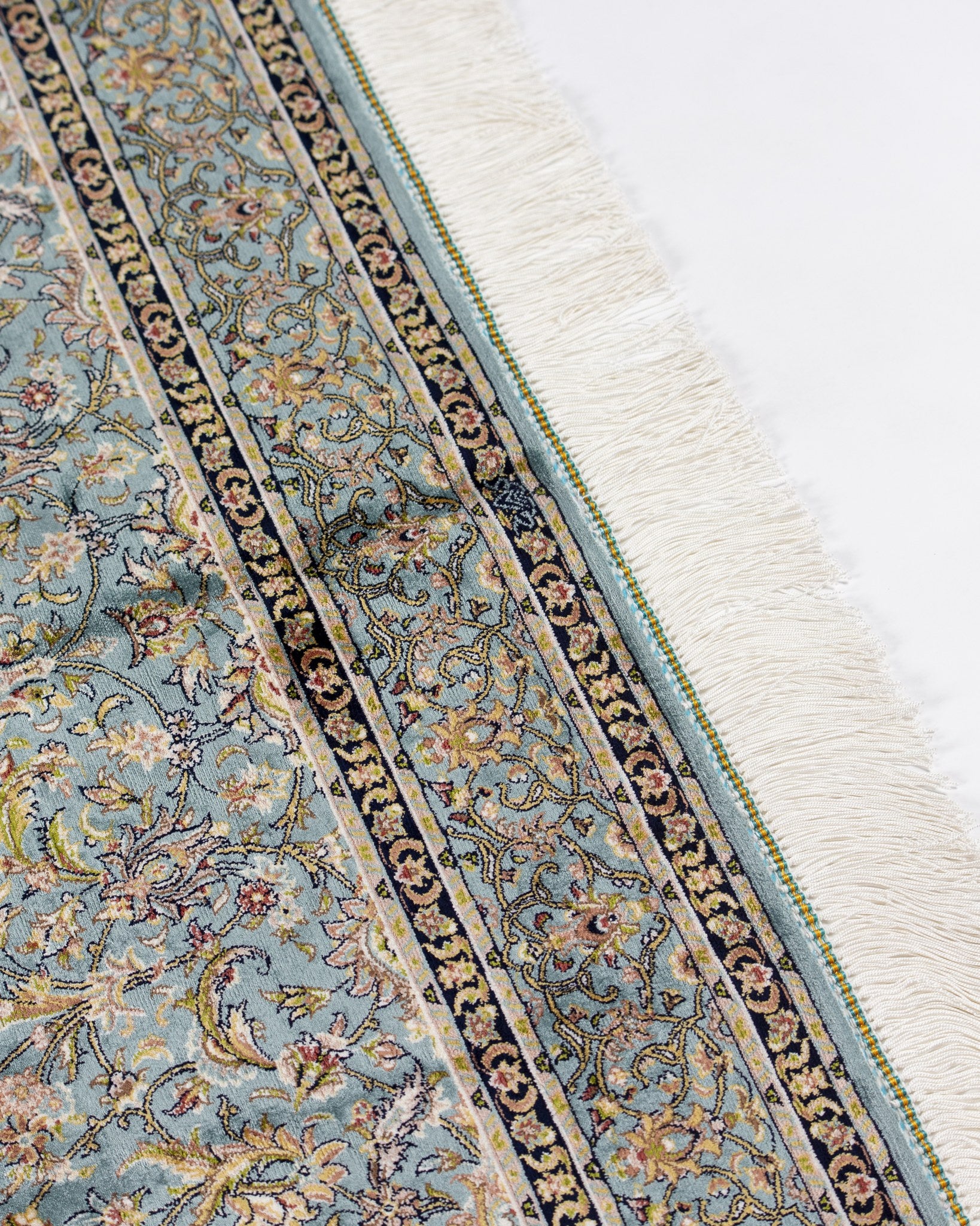 Corner of the Sitareh sage grey silk rug