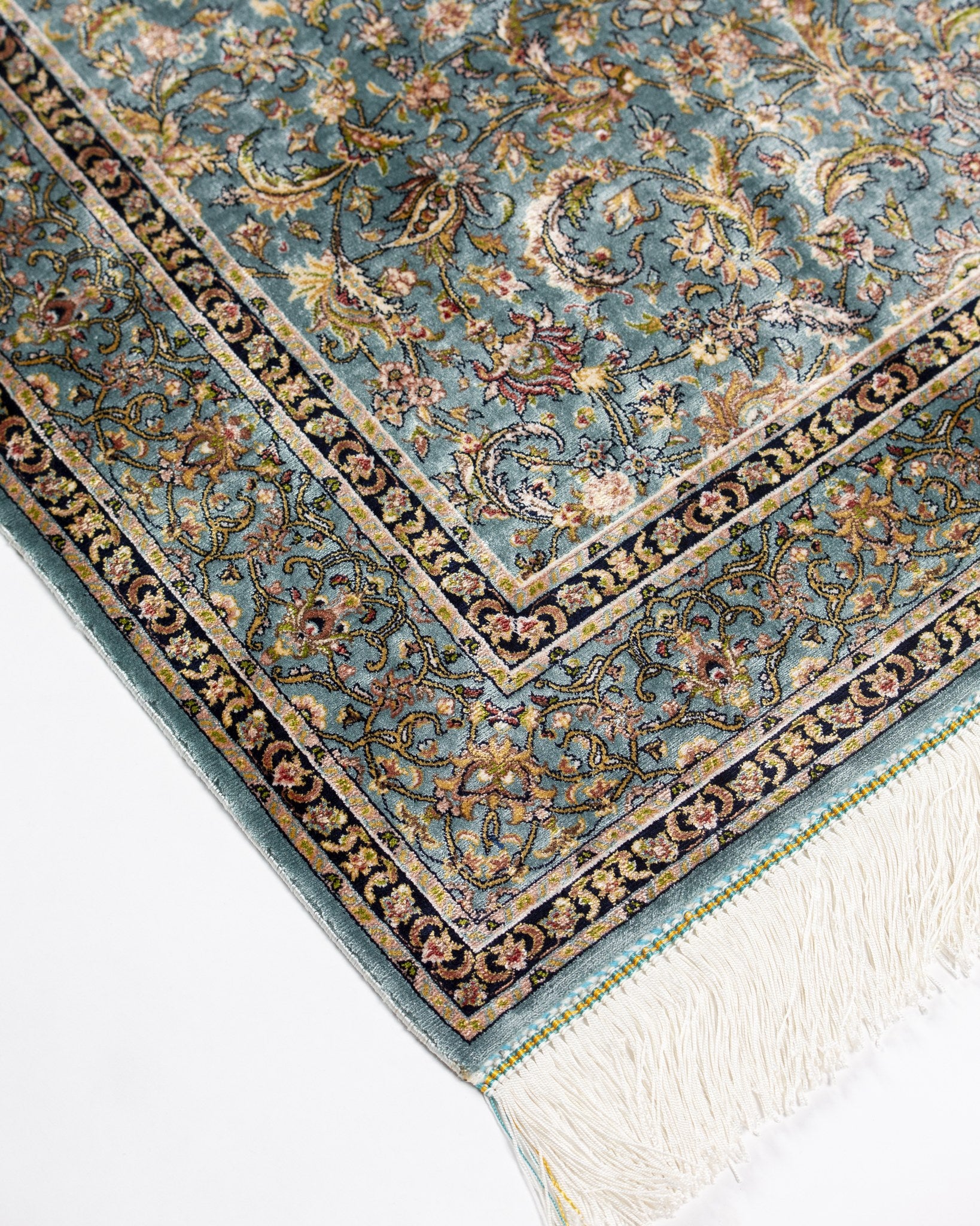Reverse of the Sitareh silk rug showing its fine weave