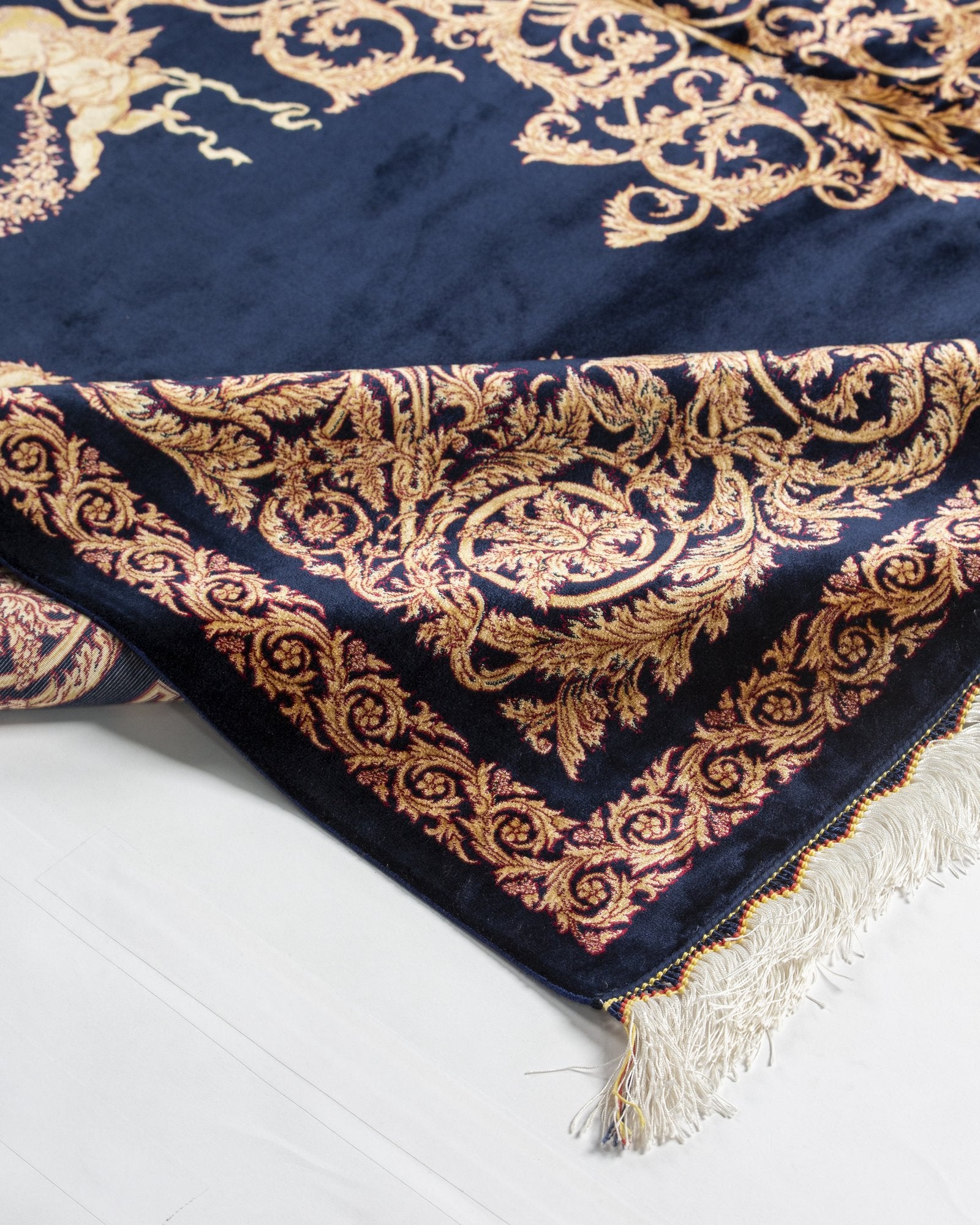 Sohrab Persian silk rug folded corner showing fine weave, navy and gold 200 x 300 cm - Tabeer Homes Dubai