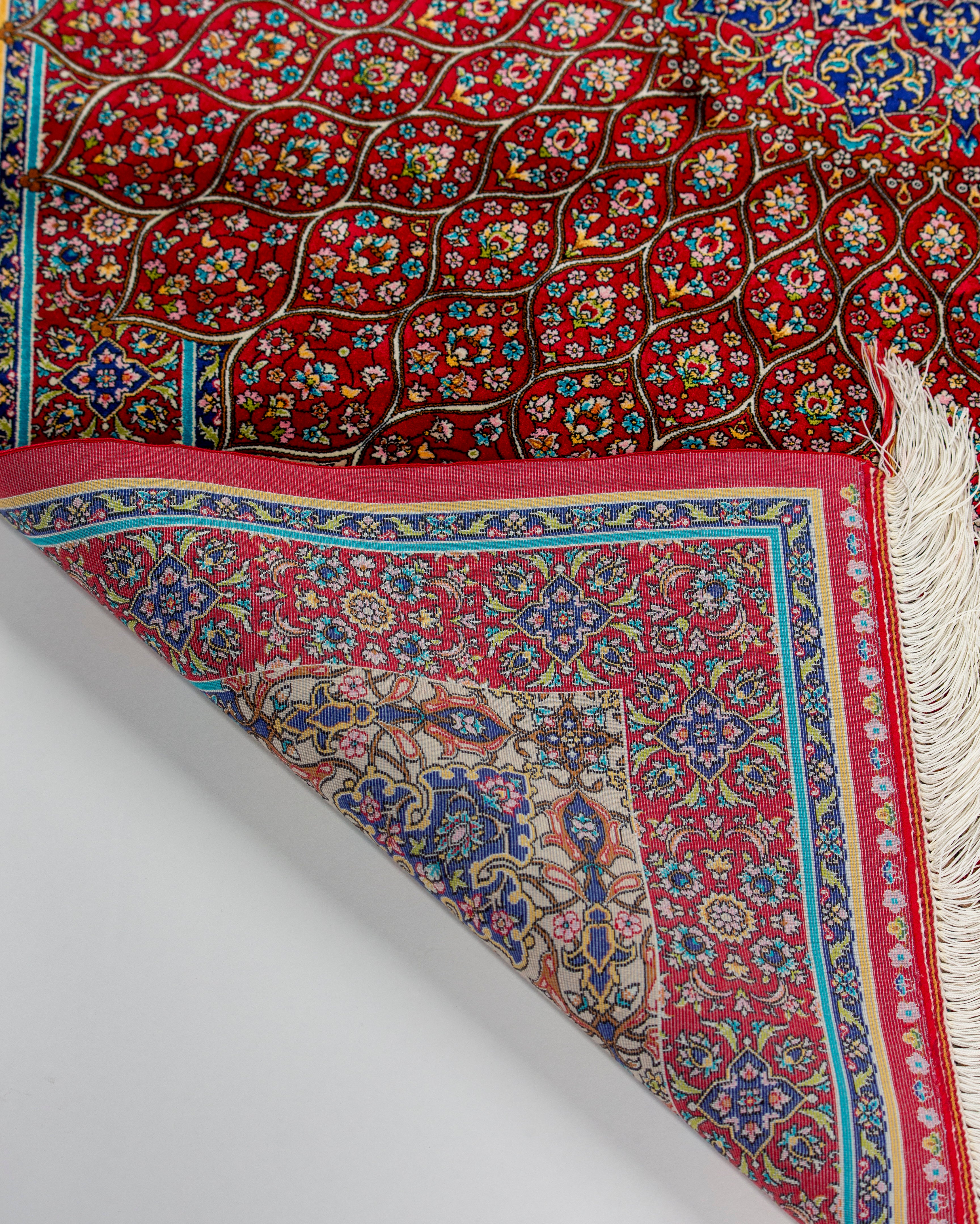 Back corner and border of the Soraya red Persian silk rug