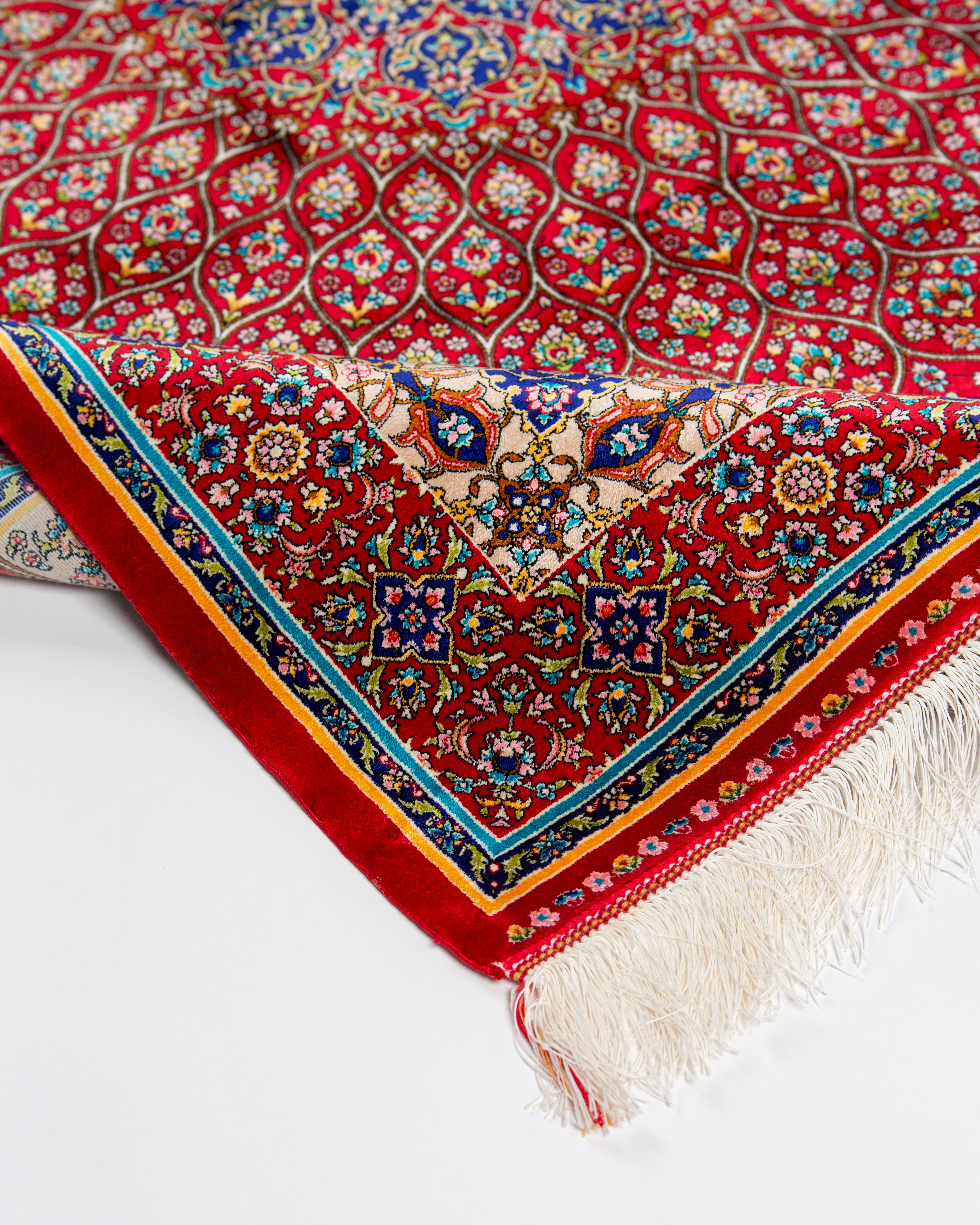 Corner border and fringe of the Soraya red silk rug
