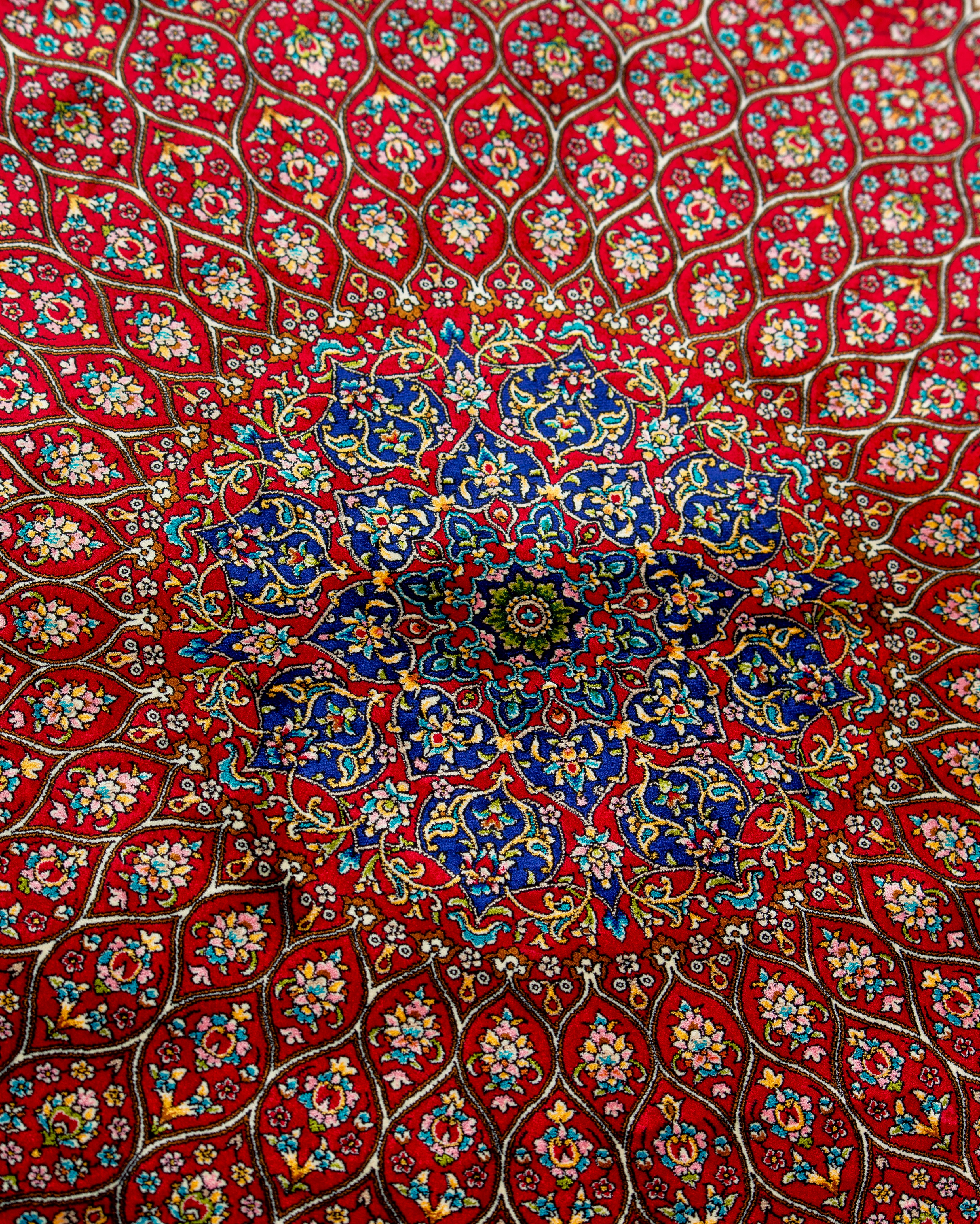 Corner and spandrel detail of the Soraya red silk rug