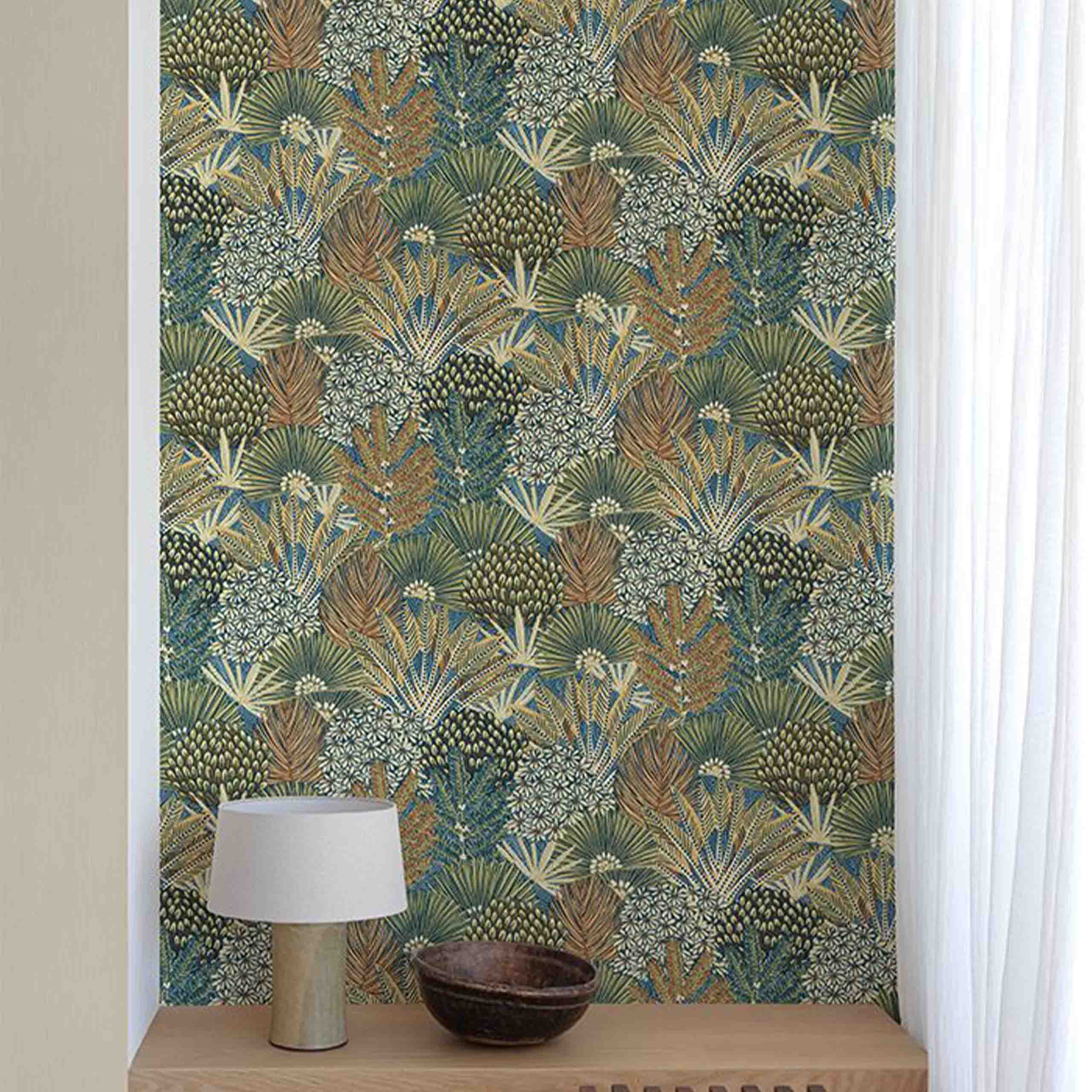 Sylvana wallpaper displayed in a cozy room, showcasing intricate floral and botanical patterns in green and teal hues.