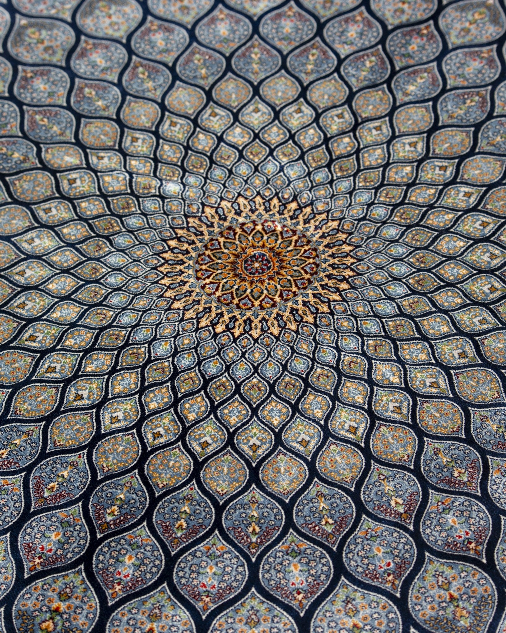 Golden centre of the Tavoos silk rug sunburst