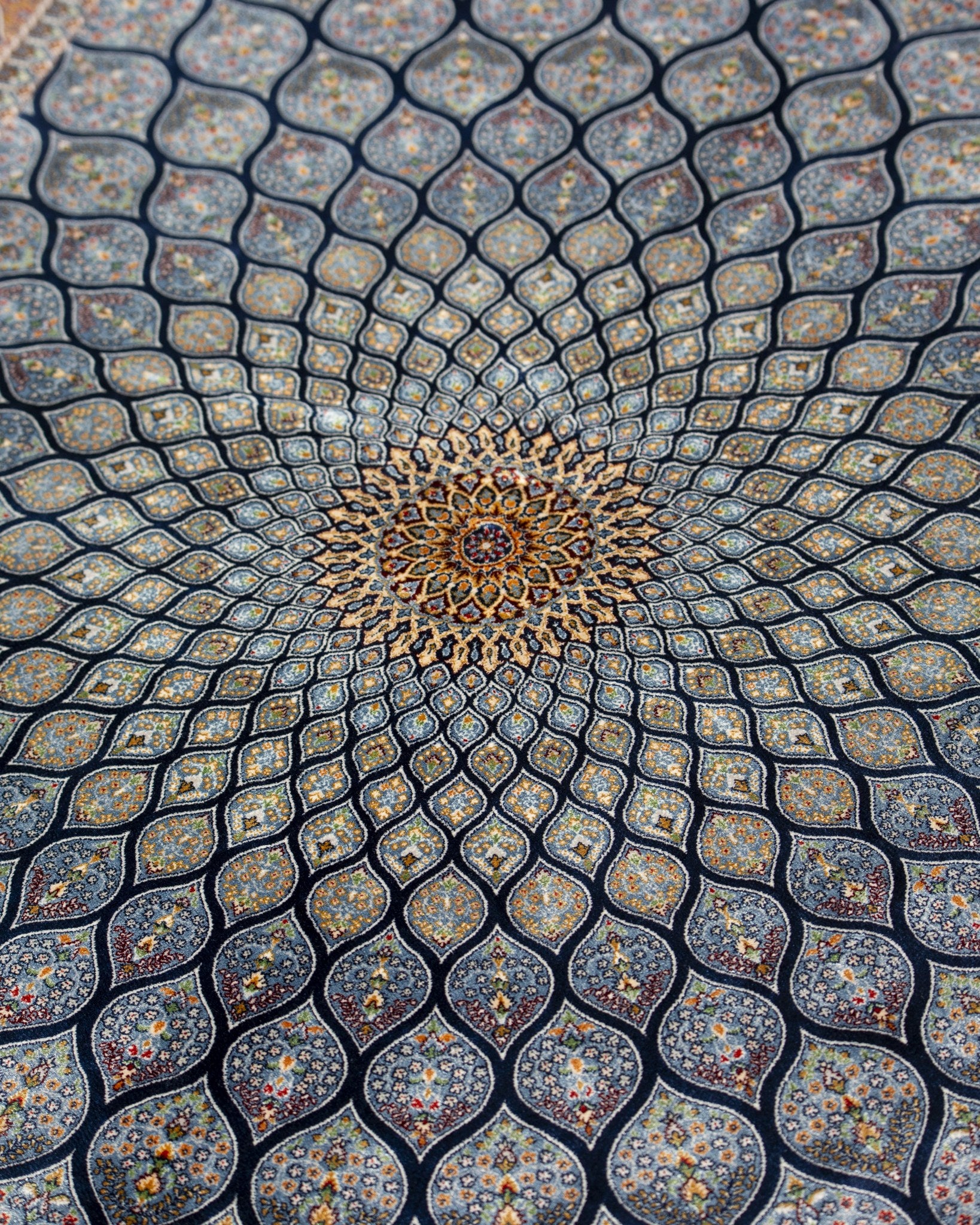 Angled view of the Tavoos silk rug