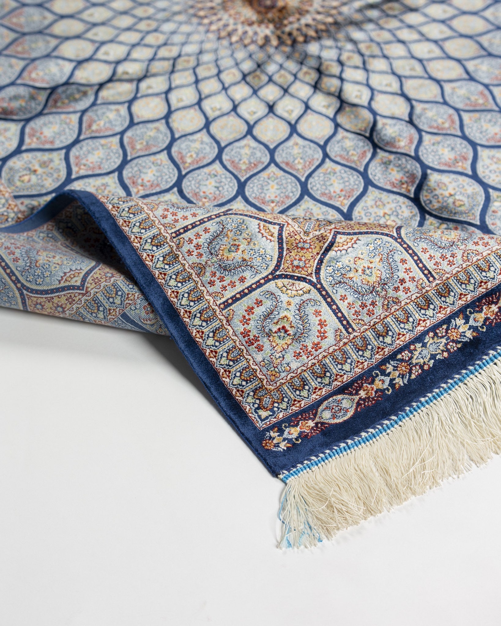 Reverse of the Tavoos silk rug showing its fine weave