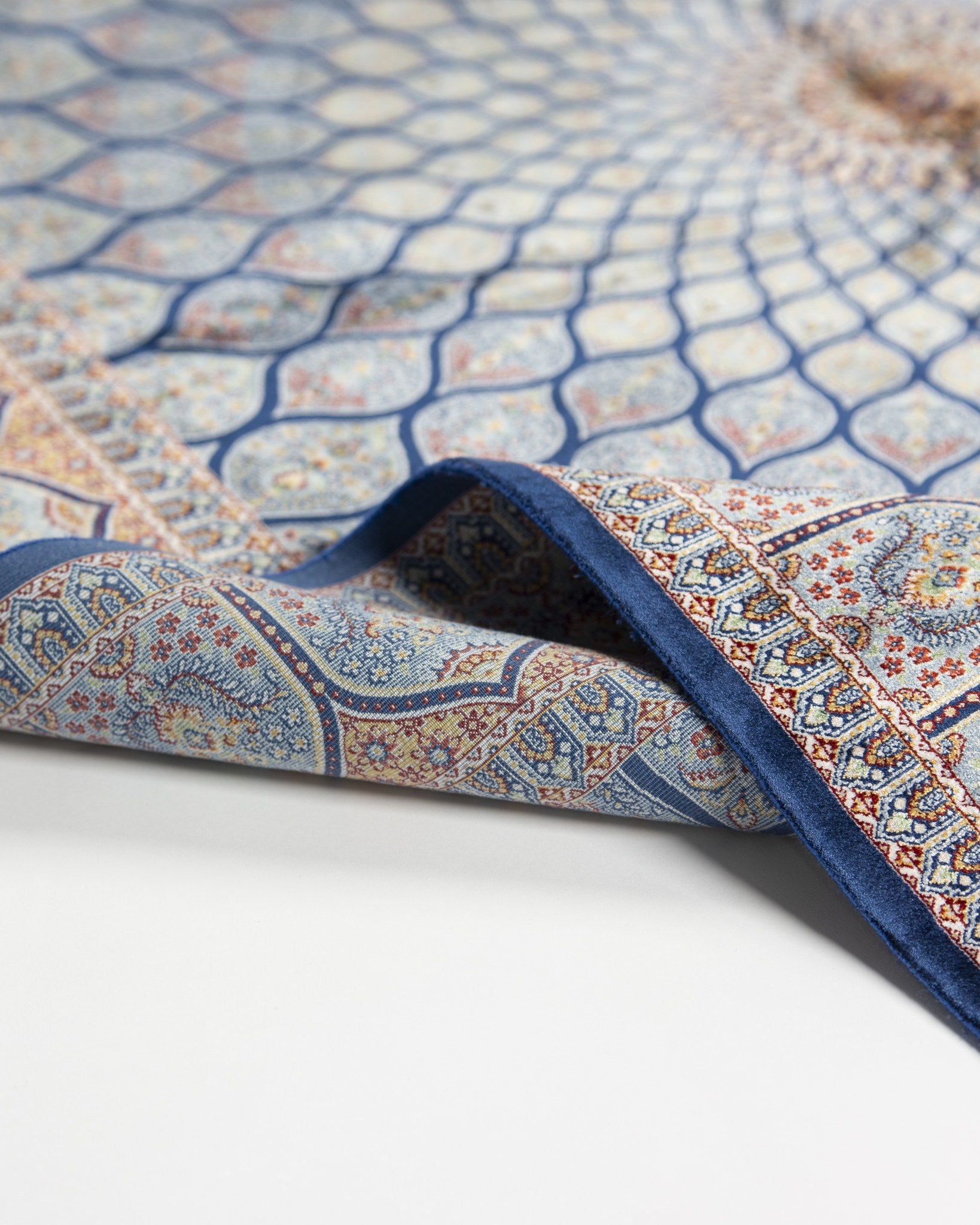 Corner of the Tavoos blue silk rug