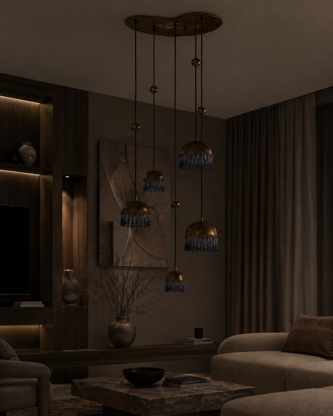 The Chime Chandelier by The Qratist features polished brass dome pendants with handcrafted porcelain drops suspended in a cascading cluster arrangement, creating an elegant sculptural lighting statement.