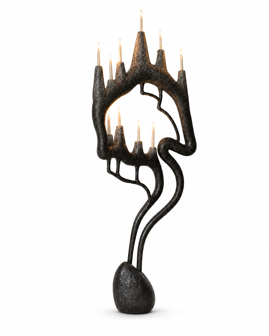 The Gothic Quarter Floor Lamp by The Qratist features a handcrafted sculptural metal frame inspired by Gothic architecture, rising organically from a solid stone base with candle inspired warm ambient illumination.